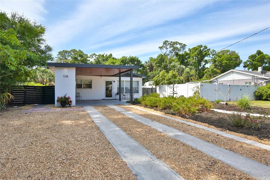 Nestled in the heart of Sarasota, this charming 1950’s ranch is an opportunity to own a tastefully remodeled home within the city limits of Indian Beach. This home has an unusually pleasing flow with a split bedroom plan and expansive common space including the kitchen and dining area.  To the front of the house, there are two adjacent bedrooms: the first guest bedroom and guest bath and the primary bedroom with en suite bath. The primary bedroom connects to the laundry room which has a passthrough door to the rear hallway of the home, taking you to the 2nd guest bedroom. There is a new single vehicle oversized carport built to current hurricane standards along with an incorporated bank of storage closets and an electrical car outlet. The sun-dappled private fenced yard conveys a feeling of great peace.  The front yard has a Zen garden.  The back yard is bordered by lush plantings offering privacy and space to enjoy a barbeque, bonfire or relaxation. In the front, the carport and oversized driveway provide plenty of room for parking of cars, RVs, toys, boats, etc. Bonus to the new owner is the Tesla Solar System including two new power walls, 24 panels (16 are only one year sold). Peace of mind with one year old roof, relined pipes including some new PVC pipes, partial concrete construction, masonry walls and in flood zone X and X500 and hurricane panels. There are no deed restrictions or HOA fees. Easy commute to downtown, beaches, colleges, Ringling, airport, restaurants, shopping at our upscale UTC mall, and much more. Indian Beach is known for its historic character, mature tree-lined streets, and proximity to the vibrant cultural scene of downtown Sarasota. Being within the city limits allows for the flexibility of weekly rentals making it a viable investment opportunity. City-owned Water Tower Park is a short walk away offering a great place to absorb nature, ride bikes, play frisbee golf, picnic, etc. Just a bike ride away you will find the Rosemary District, a hip neighborhood with cafes and modern bistros. Easy bike ride to explore art galleries, fine dining, botanical gardens, and all the culture Sarasota has to offer. Short distance to the new Bay Park with 53 acres for your walking, playing and picnicking pleasure.