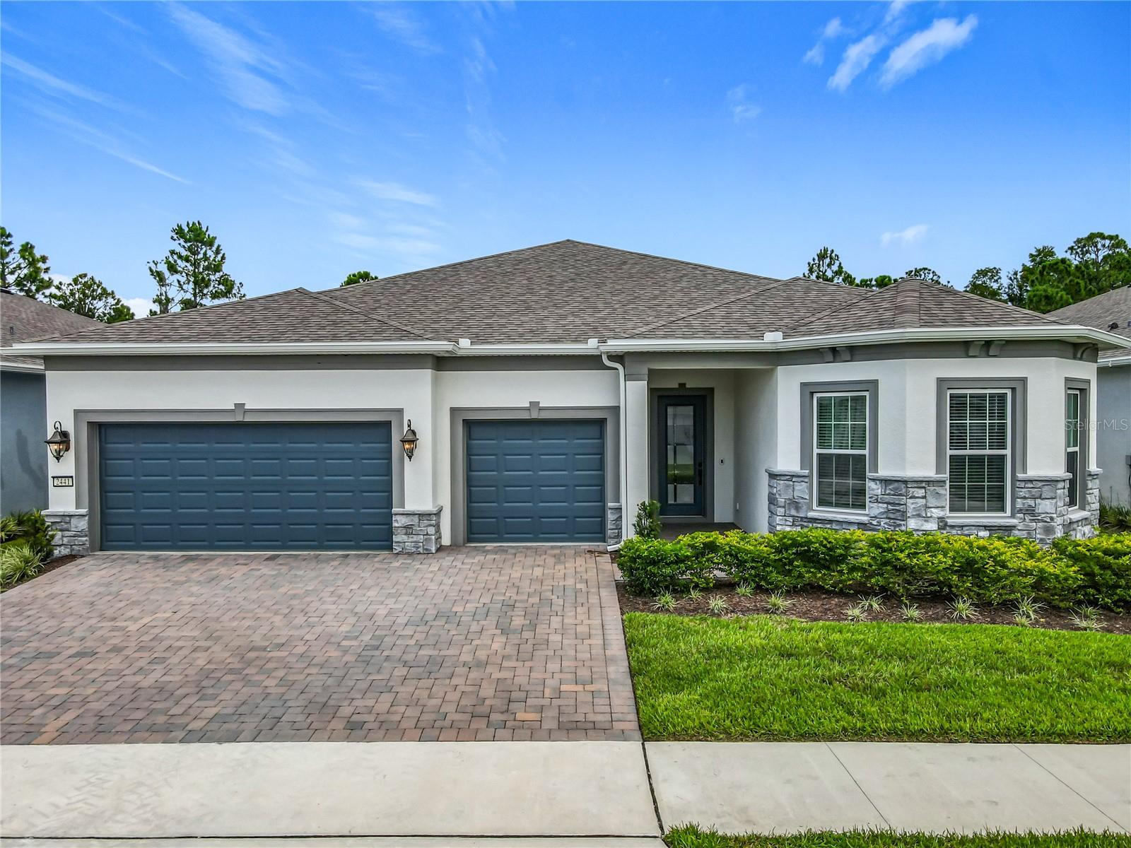 Welcome to this stunning and highly upgraded Renown floorplan home, perfectly situated in the desirable 55+ gated community of Del Webb Sunbridge. Enjoy the peace and privacy of a premium conservation homesite with no rear neighbors where you can savor beautiful sunrise views each morning from your covered, screened lanai.
This elegant Florida Mediterranean-style home with stone masonry accents features three spacious bedrooms, three and a half bathrooms, the decor embraces you with hints of French country charm, soaring 8-foot doors throughout, a private enclosed flex room, and an expansive three-car garage equipped with an EV charging station. Every detail has been thoughtfully designed for both luxury and convenience.
The heart of the home is the gourmet kitchen, a dream space for entertaining with built-in stainless steel KitchenAid appliances, a wine cooler, a large white quartz-topped island with extra cabinetry, soft-close 42-inch Flagstone cabinets with undermounted lighting, an elegant chevron dolomite mosaic backsplash, a walk-in corner pantry, and an upgraded sink and faucet. The adjacent café and gathering room is equally impressive, showcasing beautiful tray ceilings and zero corner sliding glass doors that open wide to the lanai creating a seamless indoor-outdoor living experience. The lanai is also pre-plumbed for an outdoor kitchen, making it ideal for alfresco dining and entertaining.
Del Webb Sunbridge offers an exceptional lifestyle, with resort-style amenities including lawn maintenance, internet service, and access to the Hammock Club—featuring a zero-entry pool, resistance pool, heated spa, fitness rooms, ballroom, tech seminar space, craft studios, an on-site restaurant, firepit lounge, outdoor cabana kitchen, pool table, tennis and pickleball courts, and more. The community is also natural gas powered, golf-cart friendly, and located across from the scenic 2,000-acre Split Oak Forest.
This home is move-in ready, sellers are open to also negotiating furnishings and it is still under builders warranty! Schedule your private showing today and take the first step toward the lifestyle you’ve been waiting for.