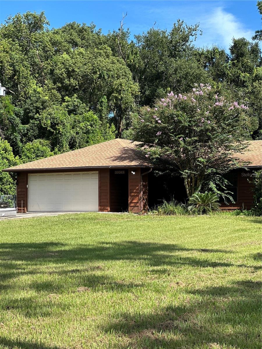 Welcome to 39343 Pretty Pond Road in Zephyrhills! This 3-bedroom, 2-bath home offers 1,616 sq. ft. of heated living space and over 2,000 sq. ft. under roof, giving you room to spread out and enjoy. Sitting on nearly a full acre (.95 acres), the property boasts a huge backyard perfect for entertaining, gardening, or relaxing in the Florida sunshine. Inside, you’ll find a spacious living room ideal for gatherings, while the newer roof provides peace of mind. Just minutes from shopping, restaurants, and conveniences, this home is full of potential. With a little TLC, you can make it truly your own! Being sold as-is.