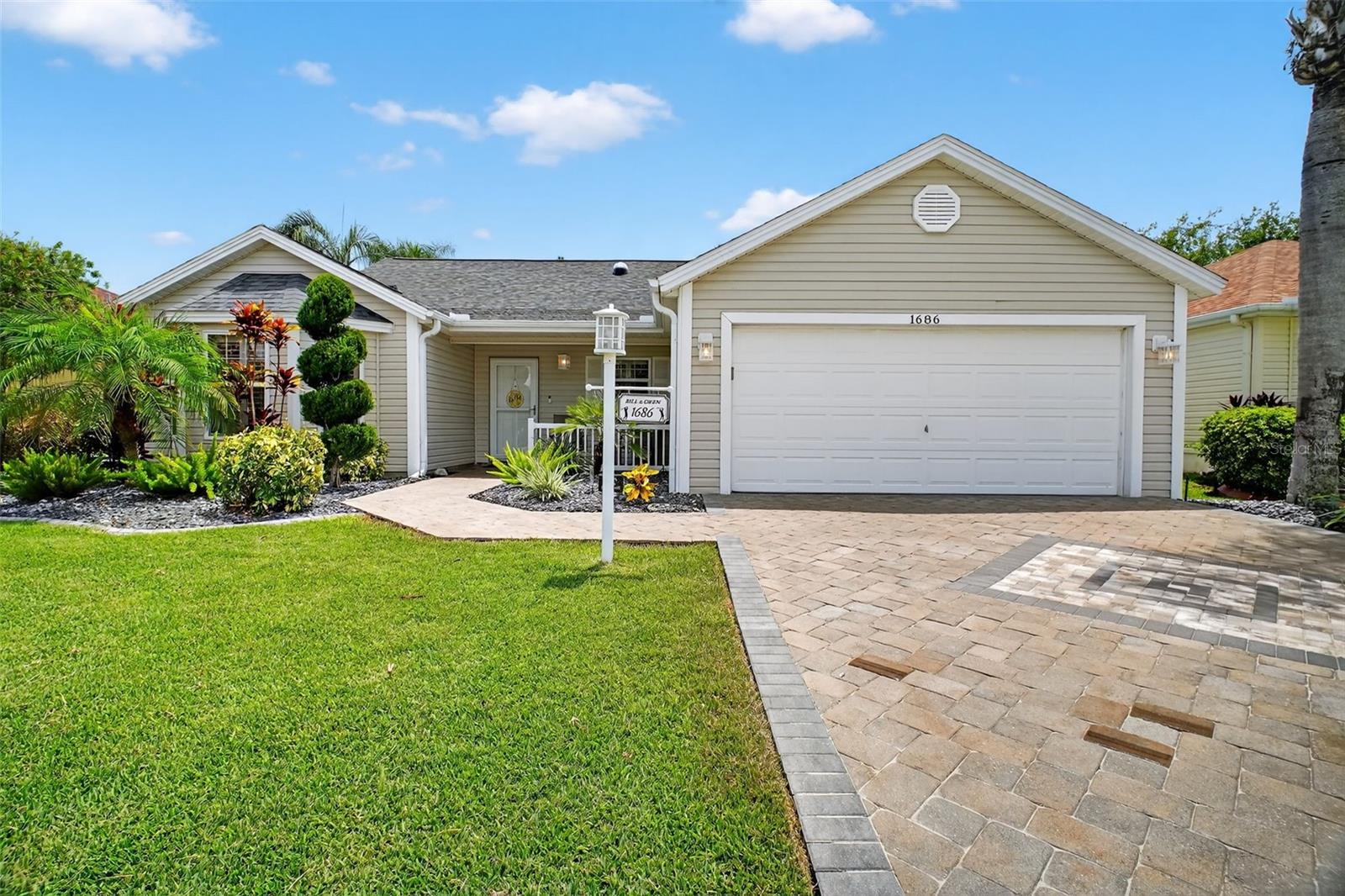 UPDATED FROM TOP TO BOTTOM – This beautifully maintained 3-Bedroom, 2-Bath Designer CYPRESS model situated on a quiet cul-de-sac street in the Village of POINCIANA. From the moment you arrive, you’ll notice the freshly refinished decorative paver driveway, elegant landscaping, glass storm door, and inviting front porch. Inside, the thoughtfully designed split floor plan is enhanced by new luxury vinyl plank flooring, crown molding, plantation shutters throughout and two solar tubes for added natural light. The spacious eat-in kitchen features extended cabinetry with a beverage cooler, granite countertops, tile backsplash, under-cabinet lighting, pull-out drawers, and stainless steel appliances including a gas range—perfect for the home chef. Additional interior highlights include updated modern light fixtures and fans, and an indoor laundry room with utility sink, folding station, and extra cabinetry. The primary suite offers two walk-in closets with custom built-ins, a dual-sink vanity with granite countertops, and a fully updated tiled walk-in shower with glass door. Both guest rooms also feature custom closet systems for optimal storage. For peace of mind, this home offers updated mechanicals including a NEW ROOF (2023), HVAC (2018), and a tankless water heater, plus a whole-house water filtration system. Additional upgrades include pull-down attic stairs and updated irrigation. Enjoy year-round comfort in the enclosed lanai under air with pull down shades that leads out to a private backyard patio framed by lush hedges. High-speed internet is on the way with Quantum Fiber Optics installation in progress. Located just around the corner from Seabreeze Recreation Center and conveniently positioned between Lake Sumter Landing and Brownwood Paddock Square, you’ll have easy access to executive and championship golf courses, dining, shopping, and nightly entertainment. This home offers the perfect blend of style, comfort, and location—your gateway to The Villages lifestyle. Schedule your private showing today!