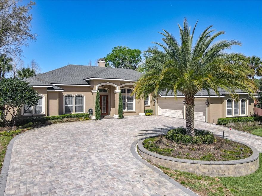 STONE ISLAND PERFECTION — UNCOMMONLY ELEGANT, YET FLORIDA CASUAL. Canalfront to Lake Monroe and the St. Johns River, this EXCEPTIONAL 4 bedroom, 3.5 bath home offers 3,400+ SF and an effortless blend of indoor and outdoor living.

You know this home is special the moment you arrive—winding up the circular paver drive, stepping through the double leaded glass doors, and taking in the striking living and dining areas with a breathtaking sightline straight through to the lanai, pool, and water beyond…WOW.
The space is extraordinary both inside and out. Inside, enjoy formal living and dining rooms, a spacious family room, private office, and an impressive game room with curved window wall, wet bar, and direct pool access—perfect for entertaining. all with gorgeous oak flooring. The 21’ Italian-inspired kitchen features a massive island, 42” wood cabinetry, granite countertops, newer appliances, a sunny nook, and bar seating, all opening to the family room and pool.The thoughtful SPLIT PLAN offers privacy for all, with each of the three guest bedrooms featuring walk-in closets and direct bath access—ideal for extended stays. The primary suite is a private retreat with custom closet, double vanities, soaking tub, walk-in shower, and direct access to the pool.

With a SEAMLESS FLOW to the awesome 1,700+ SF paver lanai and heated pool—truly an outdoor living room with beautiful views of the canal and Bird Island. This is a nature retreat. Fish for bass right from your DOCK, complete with a top-tier cement SEAWALL. 

DISTINCTIVE finishes elevate this custom residence, including DAZZLING SOLID OAK FLOORING, coffered and high ceilings, crown molding, 8’ doors, arched openings, and recessed lighting.

Additional features include an oversized 3-CAR GARAGE, paver circular drive with hidden parking pad, whole-house GENERATOR (250-gallon propane), two A/C units (2019), new ROOF (2019), exterior paint (2020), whole-house water purification system, and invisible dog fence.

Stone Island is a golf cart communitywith pickleball & tennis courts, horse stables, a community boat ramp directly on Lake Monroe, acres of parks, a lakefront pavillon, playground, and firepit. Walk or cycle to the Spring to Spring Trail & hop on your bike to the SunRail train station, or pedal all the way to the beach. This is a rare and remarkable way to live — This is not just a home — it is a lifestyle. Only 5 miles from I-4 exit 108 the drive along Lake Monroe under the giant oaks is serene -hard to believe that hospitals and shopping (Lowes, Home depot, Target) & restaurants (Olive Garden, Texas RoadHouse etc ) are less than 15 minutes away. Orlando Airport is 50 minutes and Sanford airport 20 minutes away. This is a perfect location!