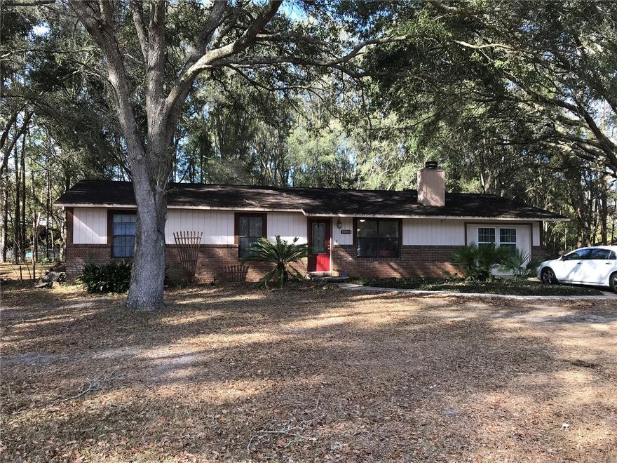 Lovely home in SW Alachua County. 3 bedroom/2 bath with a bonus room. Located on 1.1 acre. Roof is 10 years old and HVAC 9 years old. Large laundry/mud room. Living/dining room area with a wood burning fireplace, and Great room/kitchen open plan. Well and Septic, NO Homeowners association and electricity provided by Clay Electric. A couple of miles to Publix and an additional 4 miles to Shands Hospital and the VA hospital. Almost every shopping and restaurant need is in Celebration Point and Butler Plaza. An additional storage shed is located in the back yard with a deck for enjoying the outdoors s.urrounded by a large, treed canopy. Back yard is fenced