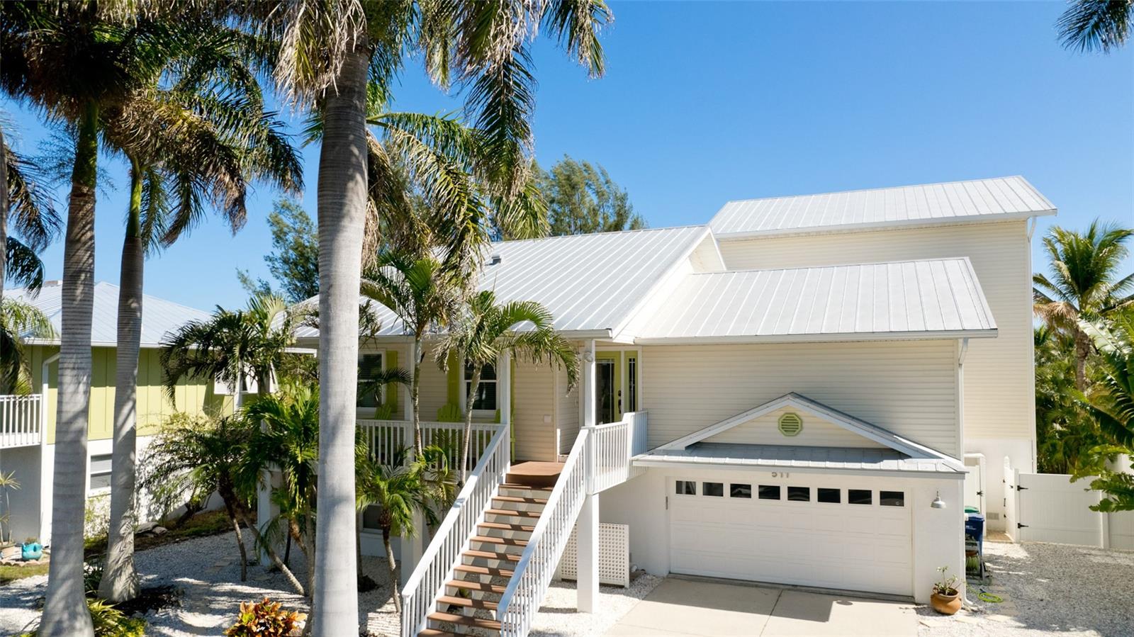 Welcome to "Sea Life Happy" 511 Magnolia Ave. This stunning CANAL FRONT HOME is deceivingly large and perfectly located close to everything Anna Maria has to offer. Beautiful beaches, the crystal blue waters of the Gulf, Pine Avenue, unique shopping, wonderful restaurants, and The Historic Anna Maria Pier, just to name a few. Anna Maria's beloved Community Center is also just down the road, offering fitness classes, youth activities, interesting lectures, Friday bingo (don't knock it til you try it), live theater and a wonderful concert series. Beyond location, there are so many special features this house has to offer. Step inside the bright and airy chef's kitchen boasting high ceilings, new stainless steal appliances, white cabinetry, island seating, large pantry, and a charming dining area with cozy window seat. A substantial addition was made to the original home in 2012 which added significant living and entertaining space including the comfortable family room, outside Balcony and entire 3rd floor. Living area offers plenty of seating and a game table for family fun night, sliding glass doors lead to a large covered balcony with a spiral staircase down to your private pool. The main floor of the home also features a cheerful office, 2 bedrooms and 2 bathrooms (one a master with walk in closet and en-suite), There is a well appointed laundry room with new washer and dryer, cabinets, counter space, plenty of storage and Central Vacuum Station. A wide staircase will take you to a 3rd level guest bedroom and a true OWNER'S RETREAT! A privacy entrance leads to a spacious master bedroom with 2 large walk-in closets and luxurious en-suite bathroom with double vanity, soaking tub and large separate shower enclosure. Now let's move on to the 2,000 sq ft of non conforming BONUS SPACE! This unbelievable home has a ground floor private guest suite large enough to accommodate a king bed and a full bed with a bunk above. Large closets and another full bathroom. Another door leads to an indoor game room and bar area, a favorite place to gather and relax after a long fun filled day on the boat. Take the party outside to the newly finished 2023 saltwater pool and spa. Your Oasis back yard includes an outdoor shower, privacy landscaping and lighting leading to a walkway between the mangroves (no seawall) to your dock and boat lift on the wide canal near the mouth of Bimini Bay with NO BRIDGES to the open waters of the Gulf of Mexico. The home also features an oversized 2 car garage with loads of storage spaces, a complete home Safeway Water Filtration System installed in 2020 as well as a reverse osmosis system in the kitchen, New AC Units, and the roof was completely refitted with all new screws and flashing this year. Currently functions as a second home and successful vacation rental, you cannot miss seeing this spectacular family home! Seller Motivated!