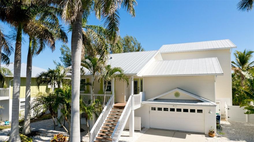 Welcome to "Sea Life Happy" 511 Magnolia Ave.  This stunning CANAL FRONT HOME is deceivingly large and perfectly located close to everything Anna Maria has to offer.  Beautiful beaches, the crystal blue waters of the Gulf, Pine Avenue, unique shopping, wonderful restaurants, and The Historic Anna Maria Pier, just to name a few.  Anna Maria's beloved Community Center is also just down the road, offering fitness classes, youth activities, interesting lectures, Friday bingo (don't knock it til you try it), live theater and a wonderful concert series. Beyond location, there are so many special features this house has to offer.  Step inside the bright and airy chef's kitchen boasting high ceilings, new stainless steal appliances, white cabinetry, island seating, large pantry, and a charming dining area with cozy window seat.  A substantial addition was made to the original home in 2012 which added significant living and entertaining space including the comfortable family room, outside Balcony and entire 3rd floor. Living area offers plenty of seating and a game table for family fun night,  sliding glass doors lead to a large covered balcony with a spiral staircase down to your private pool. The main floor of the home also features a cheerful office, 2 bedrooms and 2 bathrooms (one a master with walk in closet and en-suite), There is a well appointed laundry room with new washer and dryer, cabinets, counter space, plenty  of storage and Central Vacuum Station. A wide staircase will take you to a 3rd level guest bedroom and a true OWNER'S RETREAT! A privacy entrance leads to a spacious master bedroom with 2 large walk-in closets and luxurious en-suite bathroom with double vanity, soaking tub and large separate shower enclosure.  Now let's move on to the 2,000 sq ft of non conforming BONUS SPACE! This unbelievable home has a ground floor private guest suite large enough to accommodate a king bed and a full bed with a bunk above.  Large closets and another full bathroom. Another door leads to an indoor game room and bar area, a favorite place to gather and relax after a long fun filled day on the boat. Take the party outside to the newly finished 2023 saltwater pool and spa.  Your Oasis back yard includes an outdoor shower, privacy landscaping and lighting leading to a walkway between the mangroves (no seawall) to your dock and boat lift on the wide canal near the mouth of Bimini Bay with NO BRIDGES to the open waters of the Gulf of Mexico. The home also features an oversized 2 car garage with loads of storage spaces, a complete home Safeway Water Filtration System installed in 2020 as well as a reverse osmosis system in the kitchen, New AC Units, and the roof was completely refitted with all new screws and flashing this year.  Currently functions as a second home and successful vacation rental, you cannot miss seeing this spectacular family home!  Seller Motivated!