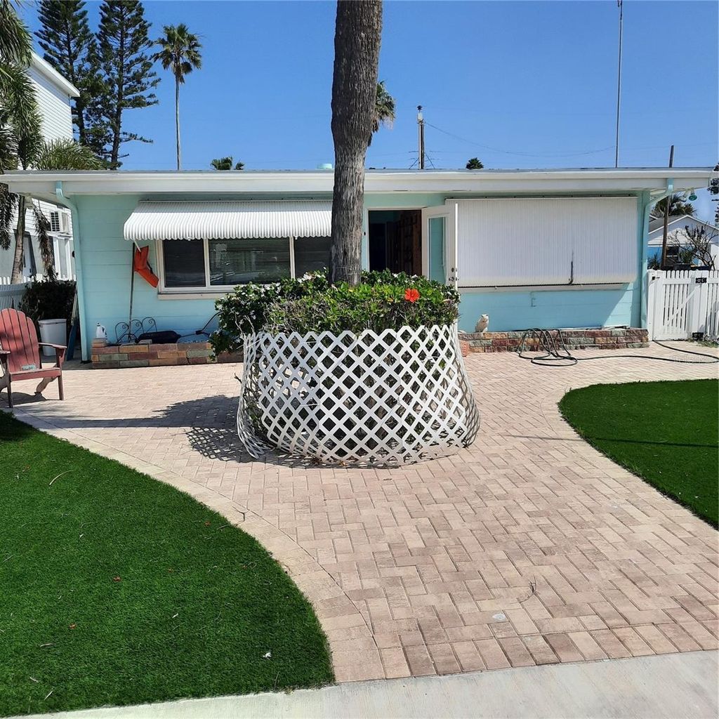 Photo of 319 Boca Ciega Dr, Madeira Beach, FL 33708 (MLS # TB8385319)