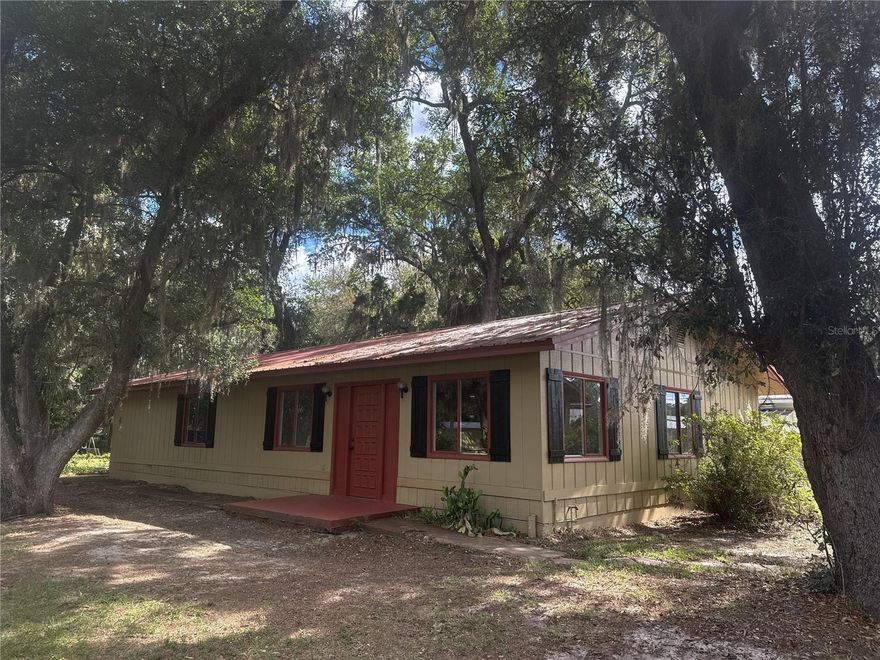 Welcome to this beautifully updated property in the heart of Ocklawaha. This move-in ready home features numerous recent upgrades including a new roof, HVAC system, water heater, flooring, fresh paint, updated vanities, and a remodeled kitchen. The main home offers comfortable living with modern finishes throughout, while the separate 2 bedroom, 1 bathroom mother-in-law suite has also been tastefully updated, making it ideal for extended family, guests, or additional flexibility. Situated on a fenced lot with a storage shed for extra space and convenience, this property offers endless potential. Conveniently located with easy access to Ocala, The Villages, lakes, and outdoor recreation. Schedule your showing today!
