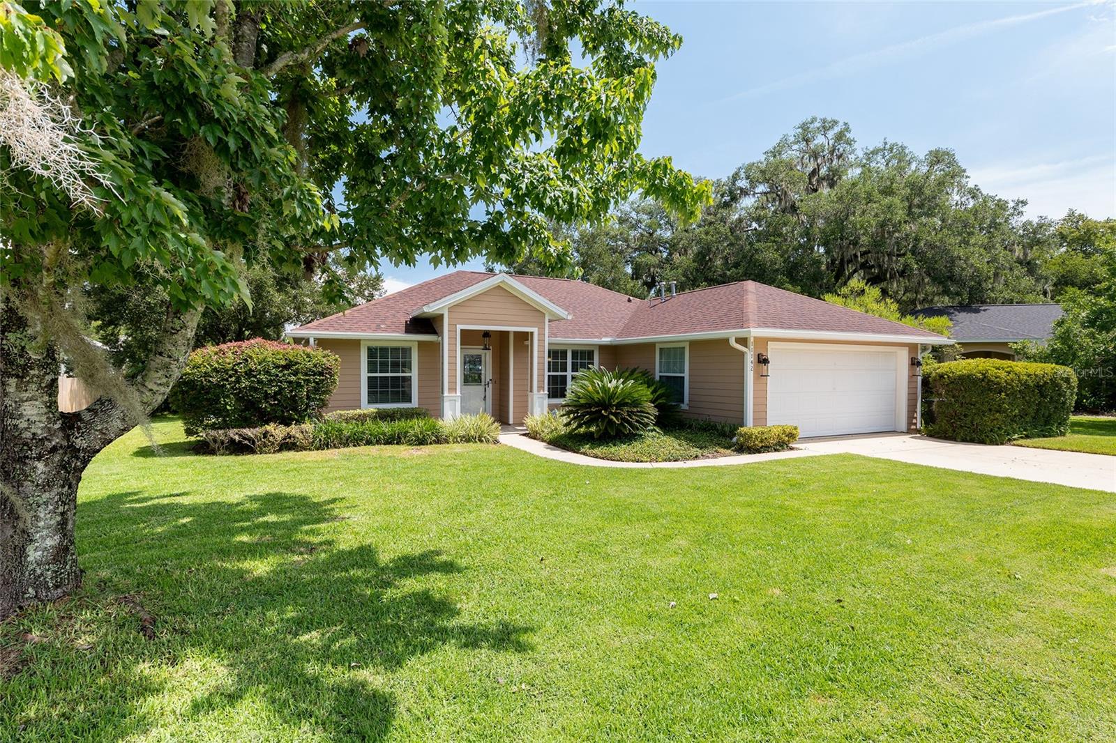 Tucked in the heart of Wellington Place, this immaculately maintained home offers the perfect blend of comfort, efficiency, and convenience. Major updates have already been completed for you, including a roof (2021), HVAC system (2020), water heater (2022), and fully paid-off solar panels installed in 2022 that significantly reduce your electric bills. The home welcomes you with an inviting open floorplan, modern light fixtures, and a toasty gas fireplace perfect for cozy winter nights. The kitchen features ample cabinet space and beautiful granite countertops. The generous-sized primary suite includes a walk-in closet and a spacious en-suite bathroom with a double vanity topped in granite. Step out into the stunning enclosed lanai, which overlooks a peaceful reserve and provides a perfect spot to unwind. The layout is designed for easy living and everyday functionality. The location also offers exceptional convenience—just minutes from Santa Fe College, North Florida Hospital, shopping centers, and I-75—while the University of Florida is less than 20-minute away. Thoughtful upgrades and prime access to everything Gainesville has to offer make this home the true definition of move-in ready.
