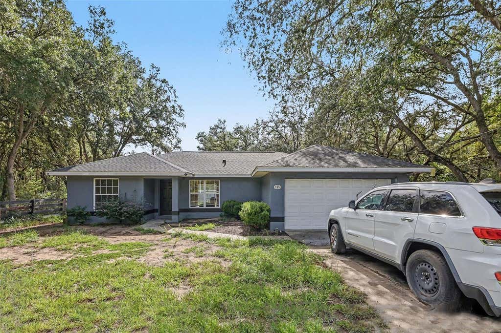 Photo of 135 Fisher Way Trail, Ocklawaha, FL 32179 (MLS # O6432390)