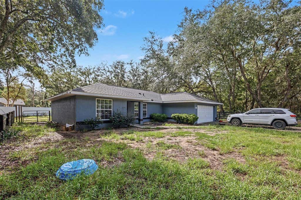 Photo of 135 Fisher Way Trail, Ocklawaha, FL 32179 (MLS # O6432390)
