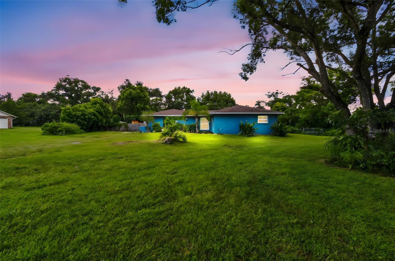 STYLISH, TURNKEY, & ONE-OF-A-KIND! This beautifully updated 3 BEDROOM, 3 BATHROOM POOL HOME is full of character and surprises you won’t find in a typical cookie-cutter model. Sitting on a full ACRE, with a screen-enclosed POOL and generous indoor/outdoor living, it’s built for gatherings you’ll be proud to host. At the heart of the home, the pass-through kitchen, dining, and living areas flow together in a circular layout that opens into a huge FLORIDA ROOM, which is perfect for entertaining and everyday comfort. The unique 3-WAY SPLIT FLOOR PLAN gives everyone their own wing of the house, and one en suite even has a PRIVATE entrance—ideal for MULTI-GENERATIONAL living or extended-stay guests. This home has been well maintained and thoughtfully improved. ALL of the bathrooms and the kitchen have been recently updated. There are many structural improvements, too, including NEW WINDOWS (2022), AC (2018), DUCT WORK (2020), ROOF (2019), a NEW 12x24 SHED (2020), and an ENCLOSED FLORIDA ROOM (2020). Outdoors, the possibilities are endless. A gorgeous climbing tree shades the front yard, while the fully FENCED backyard is ready for pets, play, or gardening. You’ll also find a BLOCK WORKSHOP with AC and a large SHED to store tools, toys, or hobby gear. With NO HOA, you can truly live by your own rules—plant a garden, raise chickens, host a bonfire, or park your RV, boat, or other big toys with ease. This is more than a home so—don’t miss your chance to claim this lifestyle of freedom, comfort, and connection—Call today!