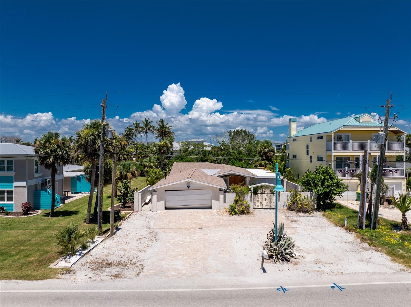 **Prime Waterfront Investment on Manasota Key — Direct Lemon Bay Access!** This 3-bedroom, 2-bath canal-front property sits on a premium lot with concrete seawall, boat lift, and immediate deep-water access to Lemon Bay. The home & lift sustained hurricane damage (Helene & Milton) and is being sold "As-Is," offering the perfect canvas for a custom rebuild or new construction. Enjoy easy beach access, great boating access, and the Florida coastal lifestyle from this exceptional location. Not many homes offer this type of direct canal-to-Lemon-Bay frontage AND close proximity to the beach!