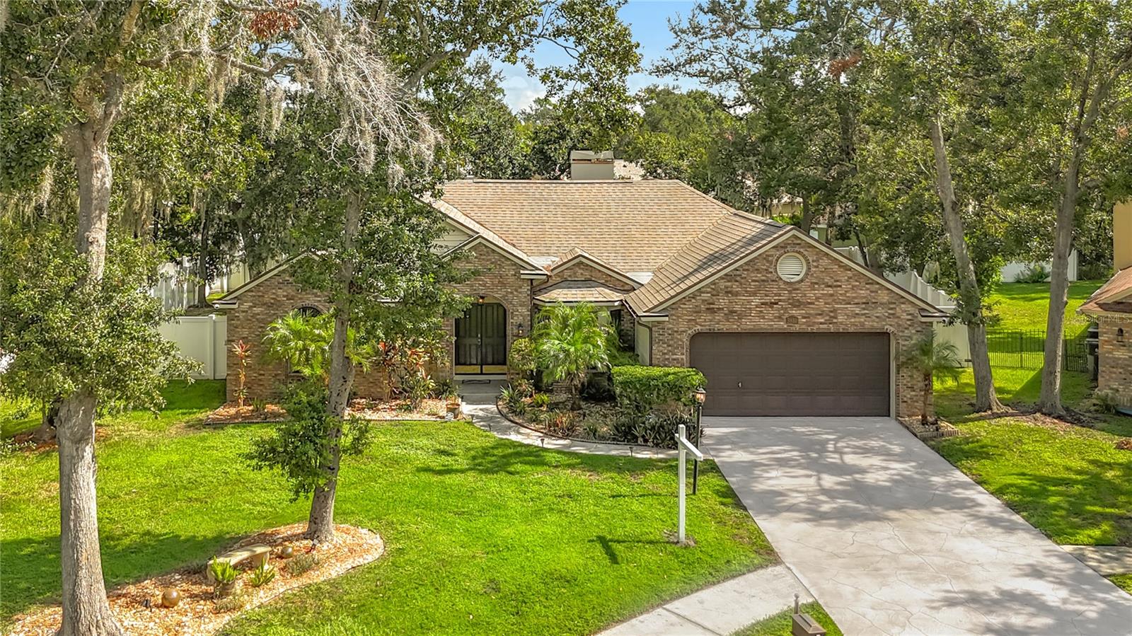 Welcome home to this charming 3-bedroom, 2-bathroom split floor plan nestled in a peaceful cul-de-sac in the highly desirable Bloomingdale neighborhood. Situated on a spacious 0.25-acre fully fenced in backyard is a true canvas for outdoor living—perfect for entertaining, gardening, relaxing, or letting Rover roam free. Inside, the generous layout includes formal spaces such as a dining room and den, a cozy fireplace in the living room, and a split bedroom design for added privacy. The updated kitchen features granite countertops and a breakfast nook adjacent to French doors leading to the patio area. While there’s room to add your personal touch. Recent upgrades including a newer roof (2018), new hot water heater ( 2025) and epoxy garage flooring (2024), and a well-maintained AC system (2018) ,all new irrigation sprinker heads on all zones ( 2025 ). All major items have been done. Additional highlights include a decorative driveway and walkway, a screened patio with pavers, outdoor Lorex security cameras, outdoor TV & Speaker System. Just blocks from Alafia Elementary and under a mile from Bloomingdale High School, with easy access to State Park , ( Lithia Pinecrest ),Publix, Aldi, Sprouts, Crunch Fitness, YMCA, and Whole Foods coming soon—this home combines comfort, convenience, and exciting potential for buyers ready to make it their own. Schedule your tour today and imagine the possibilities.