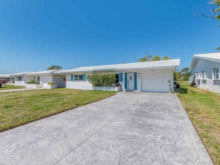 This home has it all! No backyard neighbors, just the beautiful Baypointe Conservation Area. The roof is less than a year old. The windows are impact. There is a wonderful flow to this home. The kitchen has beautiful Shaker cabinets, granite countertops and stainless appliances. The laundry room off the lanai has custom cabinets and can easily be put under air. There's an ocean breeze all year round and the lanai is a place to enjoy it. The driveway has been widened to accommodate two-plus vehicles. There's easy access to the two-mile walking trail on the Conservation.  Tamarac is a quiet, 55-plus beautifully maintained neighborhood with clubhouse and heated pool. The activities calendar is full.  The HOA fee of $230.24 a month covers sewer, water, trash, yard maintenance, cleaning of roof and painting of the home.