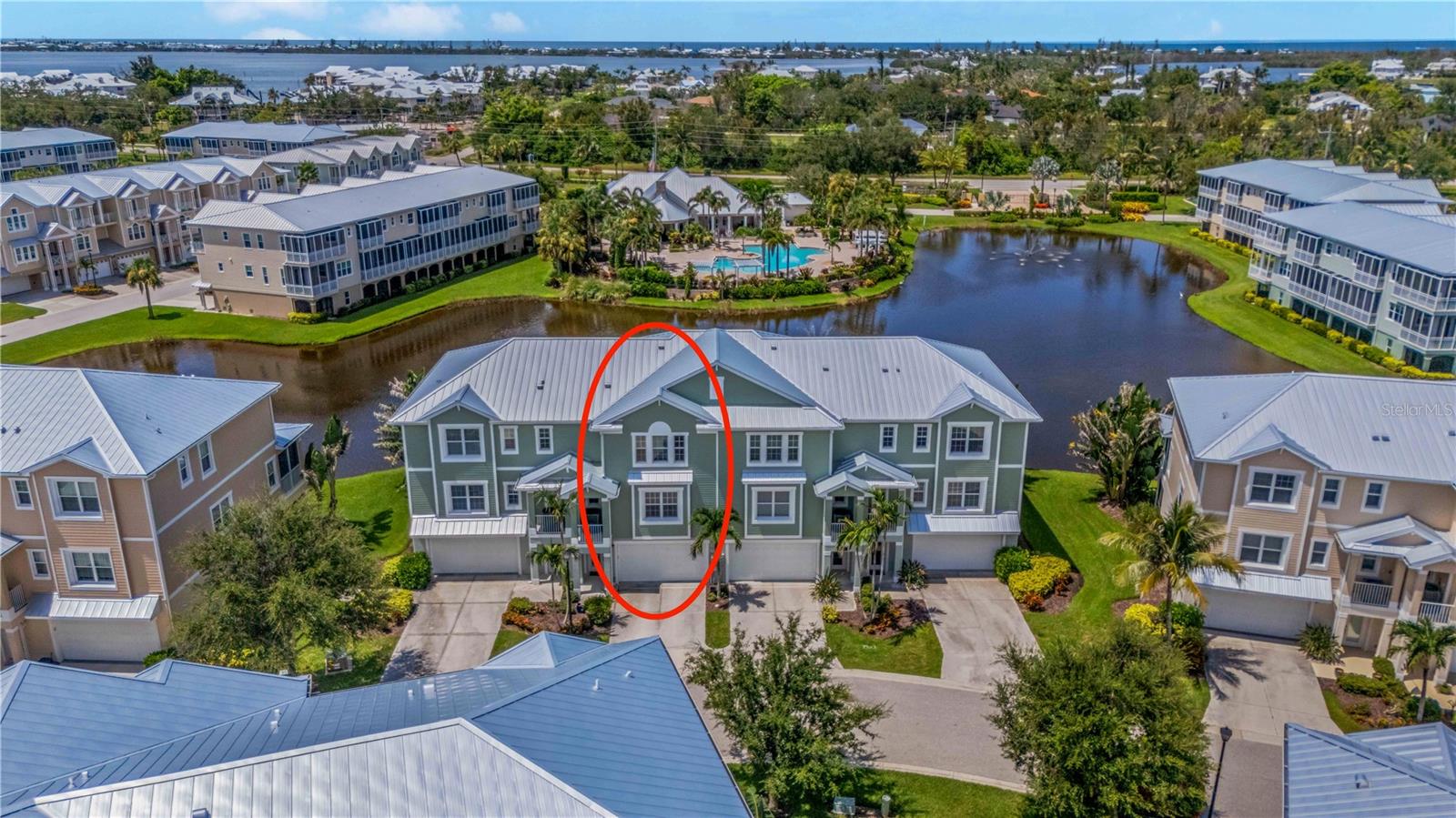 HIGHLY MOTIVATED SELLER offering one of the most desirable units at The Landings at Coral Creek! This elegant and spacious three-bedroom, three-bathroom townhouse was a former model unit and includes breathtaking western facing UNBLOCKED WATER VIEWS and tons of upgrades! The open floorplan takes advantage of panoramic west views which capture magnificent nightly sunsets over the community pond, lighted fountains, and resort-style clubhouse and landscaped pool deck. A partial list of the numerous upgrades this unit features includes designer quartz countertops throughout the kitchen and all bathrooms, private elevator access to all floors, built-in wainscoting woodwork, crown moulding, beautiful inlayed tongue and groove wood ceilings, shiplap wood panel accent walls, GE Profile appliances, hardwood flooring, custom closet built-ins, laundry room with full custom wood cabinetry and sink, and much more! In addition, this unit is one of only a few in the Landings community that features ALL CONCRETE sub-flooring throughout, which adds significant structural reinforcement to the townhome and significantly lowers foot traffic noise levels! This unit has also been constructed like a fortress to withstand the strongest of windstorms by featuring concrete block walls, a brand new highest-quality standing-seam metal roof (2023), new thickest gauge aluminum soffit installed to the highest Miami-Dade wind load standard (2023), and hurricane-rated impact doors and windows. In addition, a brand-new Trane high-efficiency 16 SEER two-stage air conditioner was installed in 2024, new electric water heater in 2023, and the entire building exterior was professionally repainted in 2024. In short, no expense has been spared in the design, construction, and on-going maintenance of this beautiful home. Community amenities at The Landings are abundant and include secure gated entry, a beautifully appointed clubhouse, work out facility, heated resort-style swimming pool and spa, tennis/pickleball court, fishing dock with kayak launch. The beautiful tropical beaches of Boca Grande are also a quick five-minute drive from the community.