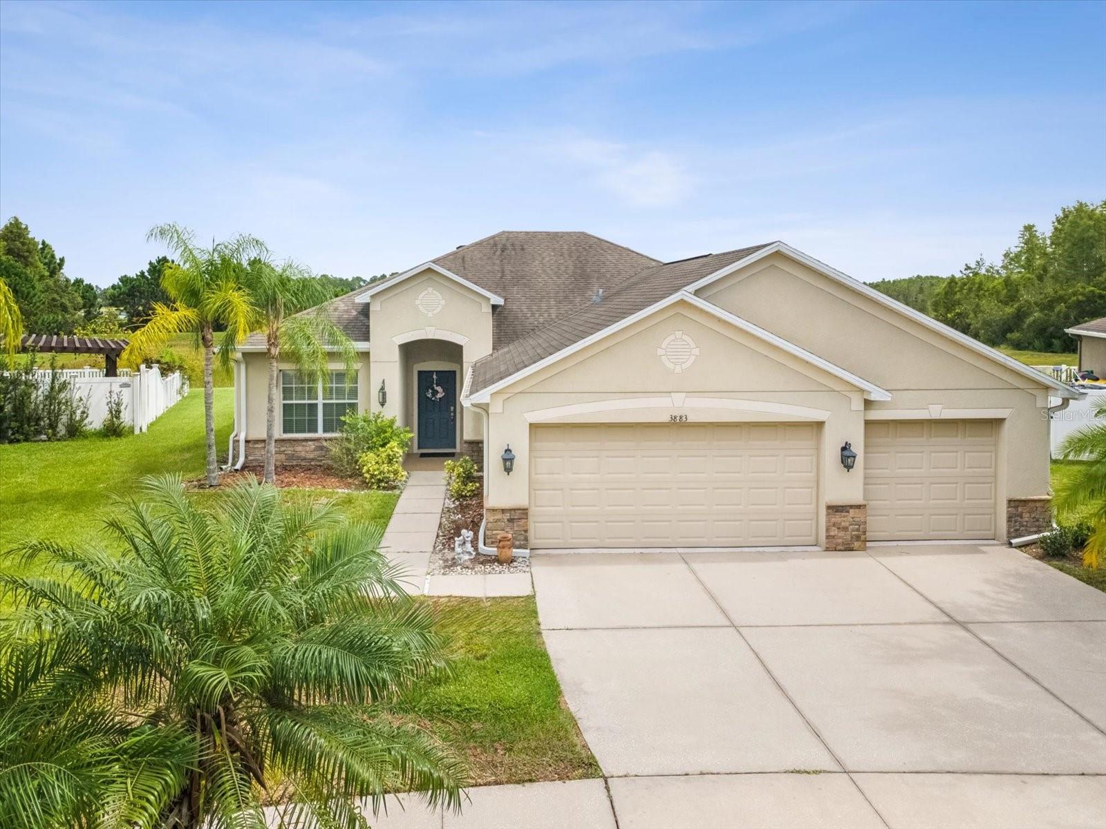 This is a 4 bedroom, 2 bathroom, 3 car garage home. The kitchen includes solid wood cabinets with granite counter tops, a pantry, stainless steel appliances and a breakfast nook. The primary bedroom includes a HUGE walk in closet and a private bathroom with a walk in shower, a garden style tub, dual sinks, a linen closet and a separate water closet area. Just to the left of the front door you will find the formal dining room. As soon as you step through the front door you will notice the beautiful view out through the sliding glass door to the back yard where you can frequently see various wildlife while relaxing on the covered and screened in patio. This home includes blinds in all of the windows and beautiful ceiling fans and light fixtures throughout. The water heater was replaced in March of this year. The Concord Station neighborhood is centrally located near everything from medical facilities to restaurants, shopping, great schools, Tampa Air Port and much more.
