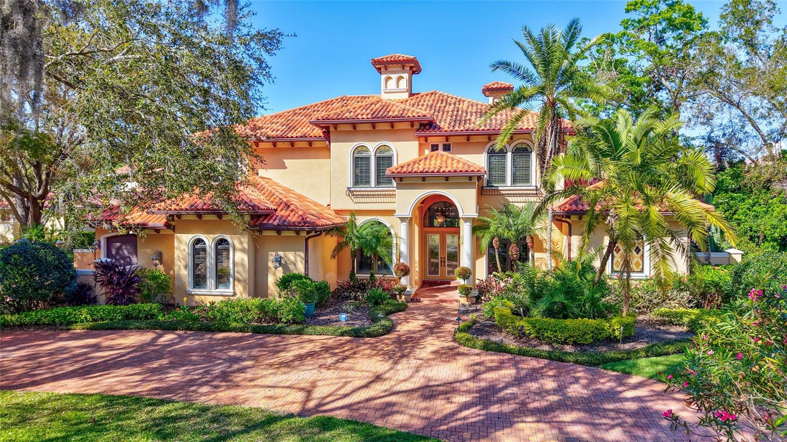 Possibly one of the BEST streets in the A+++ community of AVILA, premier 24-hour gated golf and country club community in Tampa. Tranquil street with only a handful of homes near the cul-de-sac offers its residents a safe and peaceful lifestyle. The home itself is ABSOLUTELY AMAZING! Built by the high-end custom builder Campagna Homes, no detail was overlooked in this home. 4-car garage with lots of extra space for additional cars in the courtyard and also on the oversized circular driveway adds so much functionality. The most grand foyer with high ceilings, amazing iron-cast staircase, the green outdoors and pool area that you see immediately upon your entrance, the most beautiful and elegant area around the fireplace - you immediately feel it must be something special. Primary bedroom DOWNSTAIRS, completely away from all other bedrooms. Smart and extremely well thought-out floor plan offers all the right rooms and spaces. Office near the primary bedroom, so many amazing areas for family gatherings and entertainment of guests. It is spacious, light and bright. AN OFFICE in front of the house, away from other more busy areas, so you can attend to your business without distractions. COMPLETELY remodeled kitchen, featuring contemporary cabinetry and island with the accent color. Everything is so elegant and tasteful. On the other side, you will find the coffee nook with your favorite mugs and coffee equipment for your morning coffee indulgence. Thermador appliances. 2 built-in refrigerators, 6-burner range, double-oven, lots of cabinet space and a walk-in pantry. The butler pantry is nestled between the kitchen and the dining room. On the other side of the kitchen you will find the billiard room, with the wet bar and a powder room. Theater room fully equipped with the projector and theater-seating. There are 3 fireplaces in this home – in the living room, primary bedroom, and another one between the family room and the billiard room. All other bedrooms (3) are located on the second floor. One with the en-suite bath and 2 others sharing a Jack-and-Jill bathroom. The bonus room nearby is a great space and offers so many possibilities!!! A great space that can be a yoga room, a play room, another TV room! YOUR TEENAGERS will never want to leave the house - this is such a great gathering space! YES, this home offers it all. SO MANY possibilities! INCREDIBLE serene and private outdoor oasis awaits outside. Outdoor kitchen, covered and open areas. Large fenced-in yard. Come, fall in love, make it your home…