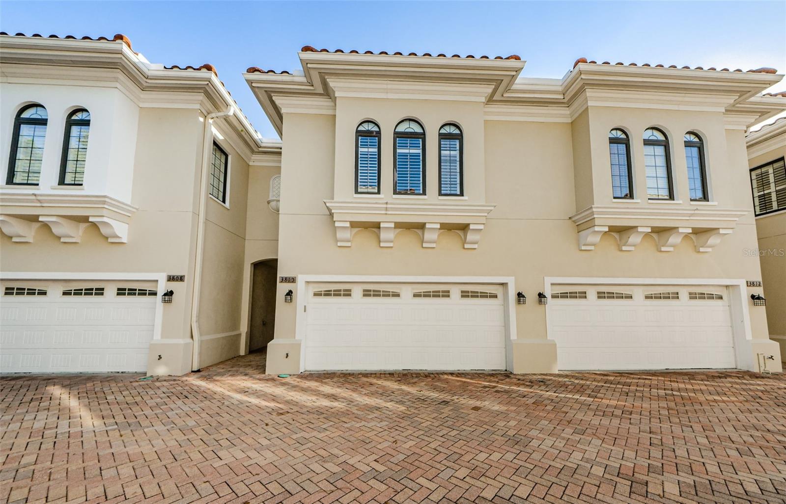 This immaculate Mediterranean-style townhome offers the best in high-end looks and finishes. The location of this gated community townhome is second to none. Centrally in South Tampa, which offers you A-rated schools, endless dining and nightlife options, amazing shopping, a 10-minute commute to the airport, the list goes on and to top it off it is right next door to Trader Joes! The home itself is immaculate featuring granite countertops, cherry oak cabinetry, and closet systems, recessed lighting, 10-foot ceiling height, 6-inch baseboards, 7.5-inch crown molding, travertine and wood flooring. The first floor features a half-bath, open kitchen with pendant lights above breakfast bar, stainless steel appliances, kitchen island with above lighted hanging pot rack, electric faux fireplace with heater function, dual pairs of large metal French doors that open to a back ivy-walled courtyard area. Stairs to the second floor greet you with wooden steps and handrails, travertine risers, and wrought iron spindles. The second floor features all three bedrooms, laundry closet, massive primary bedroom with plantation shutters, spacious main bath with Jacuzzi spa/tub and travertine shower, and walk-in main closet with wood closet system. Make this gem your home today.