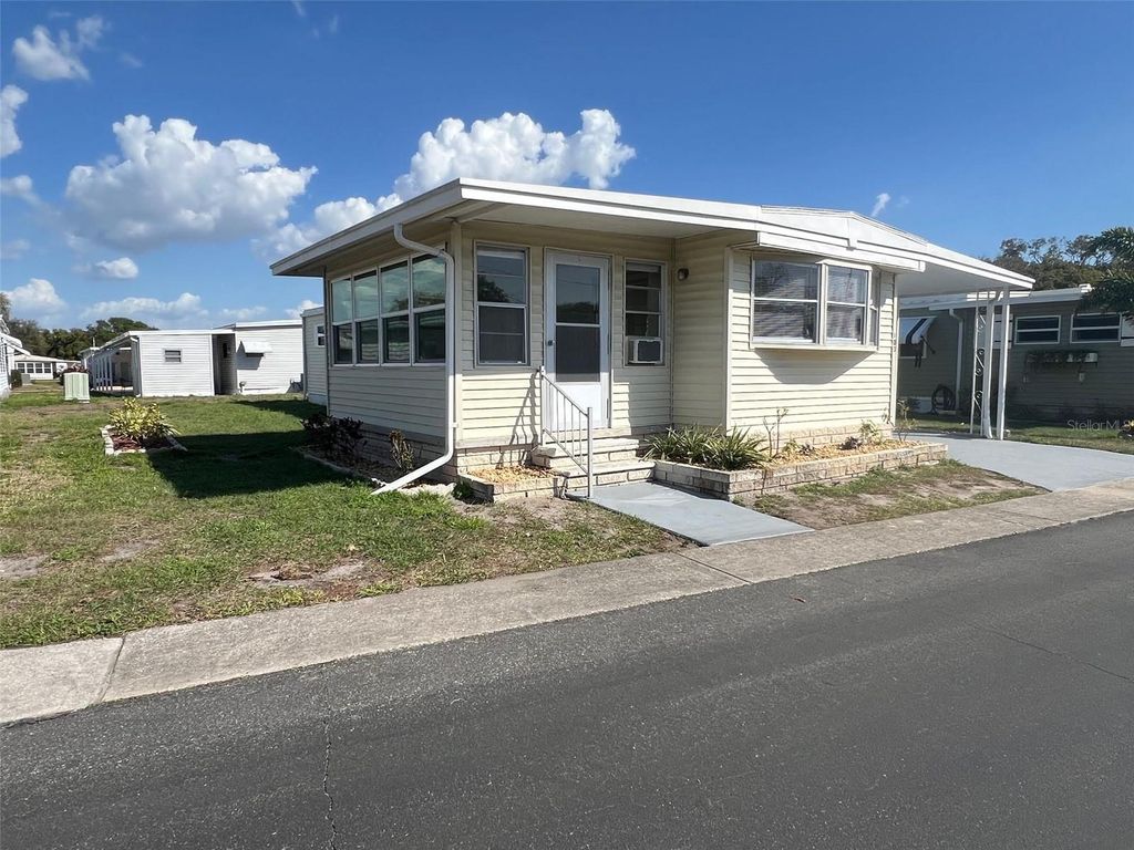 Photo of 103 Pindo Palm Street W, Largo, FL 33770 (MLS # TB8485756)