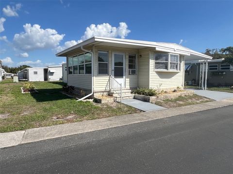 Photo of 103 Pindo Palm Street W, Largo, FL 33770 (MLS # TB8485756)