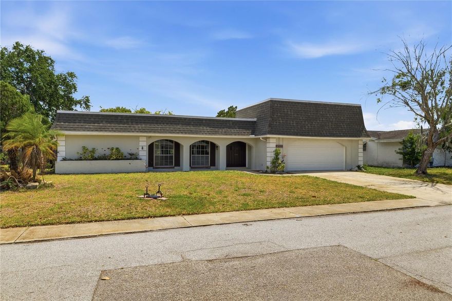 Seller is motivated and open to reasonable offers. Welcome to this well-maintained 3-bedroom, 2-bath home featuring a desirable split floor plan and a spacious 2-car garage. The interior offers a comfortable and functional layout, including a bright living area and a kitchen appointed with granite countertops. The generous 7,650 sq ft lot provides ample outdoor space for relaxing, gardening, or future enhancements.
Located in a convenient area of New Port Richey, this home offers easy access to major roadways, shopping centers, medical facilities, parks, and local amenities. Its position within an established residential community provides a practical blend of comfort and accessibility. With no CDD fees, this property presents an excellent opportunity for those seeking value and convenience in a central location.