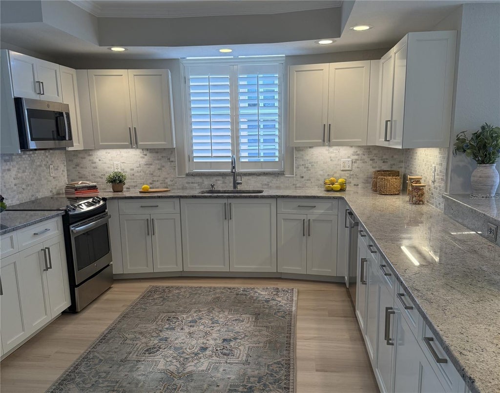 Photo of 4961 Bacopa Lane S #201, St Petersburg, FL 33715 (MLS # TB8551029)