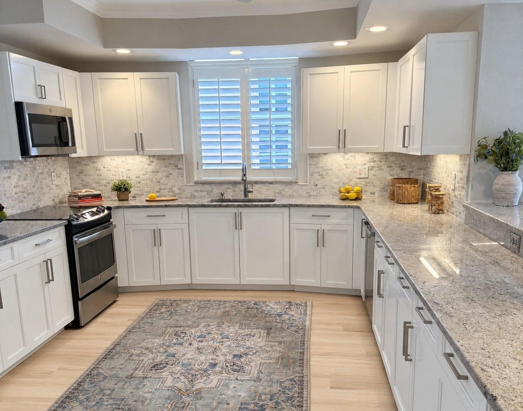 Photo of 4961 Bacopa Lane S #201, St Petersburg, FL 33715 (MLS # TB8551029)