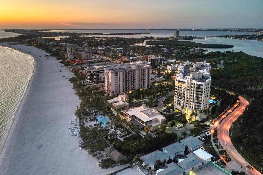 Step into Luxury, Privacy and Spectacular Views of the Gulf of Mexico at Ritz Carlton managed The Beach Residences, renowned for luxury service. Beautifully designed and appointed, the casual coastal elegance evokes the best of Florida living. As you enter this extraordinary 11th floor residence you are drawn to a sea of blue from the expansive great room and inviting sitting area with fireplace surrounded by a 10' x 33' open air terrace overlooking glistening azure water for quiet relaxation, entertaining and breathtaking sunsets. A perfect blend of indoor and outdoor living, this magnificent waterfront retreat boasts 3964 sq. ft., 3 bedrooms, 3.5 baths, study, distinctive great room design, private elevator entry and 2 car under building parking. Offered Turn-Key Furnished the exquisite interior design, upscale furnishings and elegant finishes combine with beautiful owner appointments and original artwork for transitional appeal. Welcoming foyer, 10’ ceilings, detailed lighting, French limestone flooring, travertine balcony and marble baths compliment the refined design. Chef inspired kitchen features Italian marble counters, island, breakfast bar for casual dining, Thermador gas cooktop and hood, built-in convection microwave and oven, Bosch dishwasher, beverage drawers, ice maker, Sub-Zero side by side and 2 Sub-Zero wine refrigerators. Retreat to the wonderful owners suite featuring gorgeous waterfront vistas, sliders to balcony, wet bar, dual built-in closets, deluxe soaking tub, large shower and dual vanities. Ensuite guest wing and ensuite guest bedroom and bath provide privacy for all. An optimal built-in home office,  generous laundry room and separate storage complete this exceptional residence. A quiet sanctuary situated on pristine Lido Key Beach with 24 hour Concierge, exclusive resort style amenities and pet friendly building where you will enjoy the perfect island experience. Paver walkways meander through the natural beauty of tropical landscaping to enjoy early morning beach walks and nightly sunsets. The Owner’s Club features gathering room, billiards, theater, state of the art fitness center, pool, spa, massage room, saunas, firepit and grills. Optional Ritz Carlton Beach/Spa Membership is available with this residence, a non-refundable membership fee and annual dues is required. Exceptional surroundings and lifestyle includes acclaimed restaurants and shopping on St. Armand's Circle, just minutes away, and Sarasota's vibrant downtown, art galleries, performing arts venues and beautiful bayfront setting.