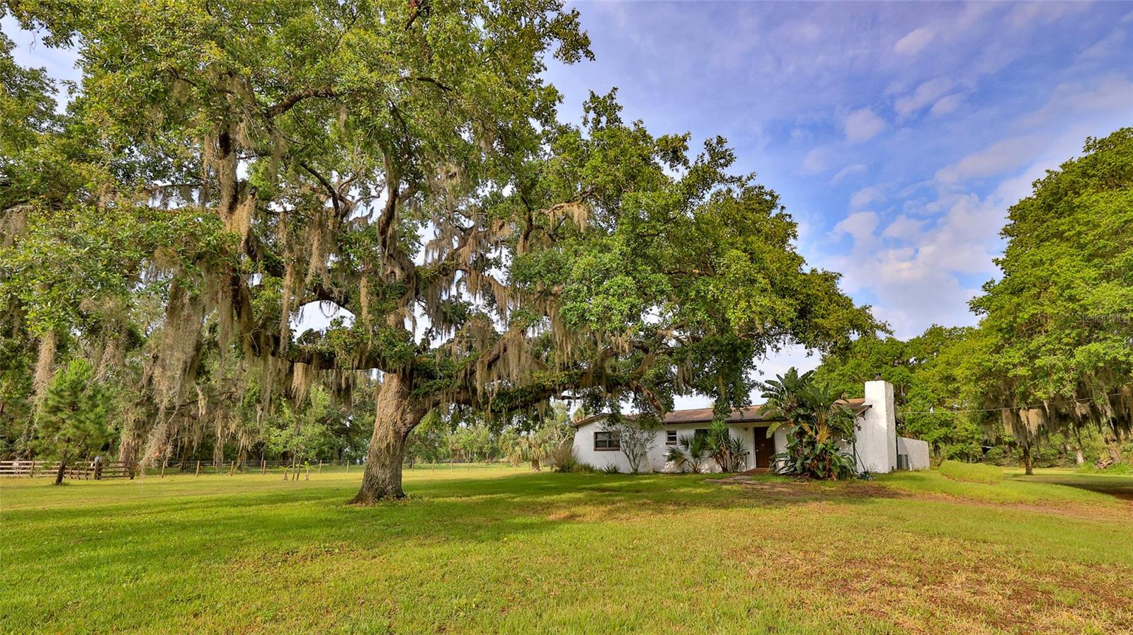 Endless Potential in a Prime Location!
This unique 2.67-acre property features a 3-bedroom, 1-bath home with a swimming pool nestled amongst several majestic oak trees in a peaceful, well-located neighborhood. Whether you're looking for a private homestead, rental income, or the perfect place to entertain, this property offers it all. Equipped with two wells, two septic systems, and two RV hookups, the infrastructure is in place for flexibility and expansion—build a barn, guest house, or more. Located near Rotary Park, the East Coast Regional Trail, and just minutes to Daytona State College, New Smyrna Middle School, riverside parks, a public boat ramp, and local dining and shopping. Enjoy quick access to the beach, golf, pickleball, and the YMCA. A rare opportunity to own acreage with convenience, recreation, and room to grow.