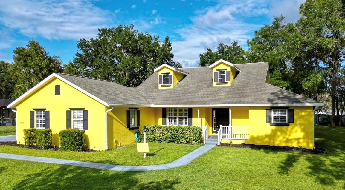 One or more photo(s) has been virtually staged. ASSUMABLE LOAN 2.375%!!!!! Exceptional Florida Living on a Double Lot –fenced on 3 sides, No Deed Restrictions! This beautifully maintained home welcomes you in with an elegant front entry including a beautiful transom window above the door filling the entry with natural light. This 3-bedroom, 2-bath, 2+ golf cart garage home offers rare space, privacy, and flexibility. The primary suite is a retreat of its own—featuring a spa-like walk-in shower, two walk-in closets, and a charming flex space with French doors leading to the screened lanai and hot tub. The open layout offers a formal dining room for gatherings, a cheerful breakfast nook, and a walk-in pantry for added storage convenience. A dedicated laundry room keeps daily living organized, while the oversized garage easily accommodates two vehicles plus a golf cart or mower. Outside, the double lot provides extra breathing room, native vegetation that attracts butterflies and includes a detached storage shed for tools, hobbies, or seasonal gear. With original-owner care since 2008 and no deed restrictions, this move-in-ready home blends comfort, versatility, and a hard-to-find combination of features—making it a standout choice in today’s market.