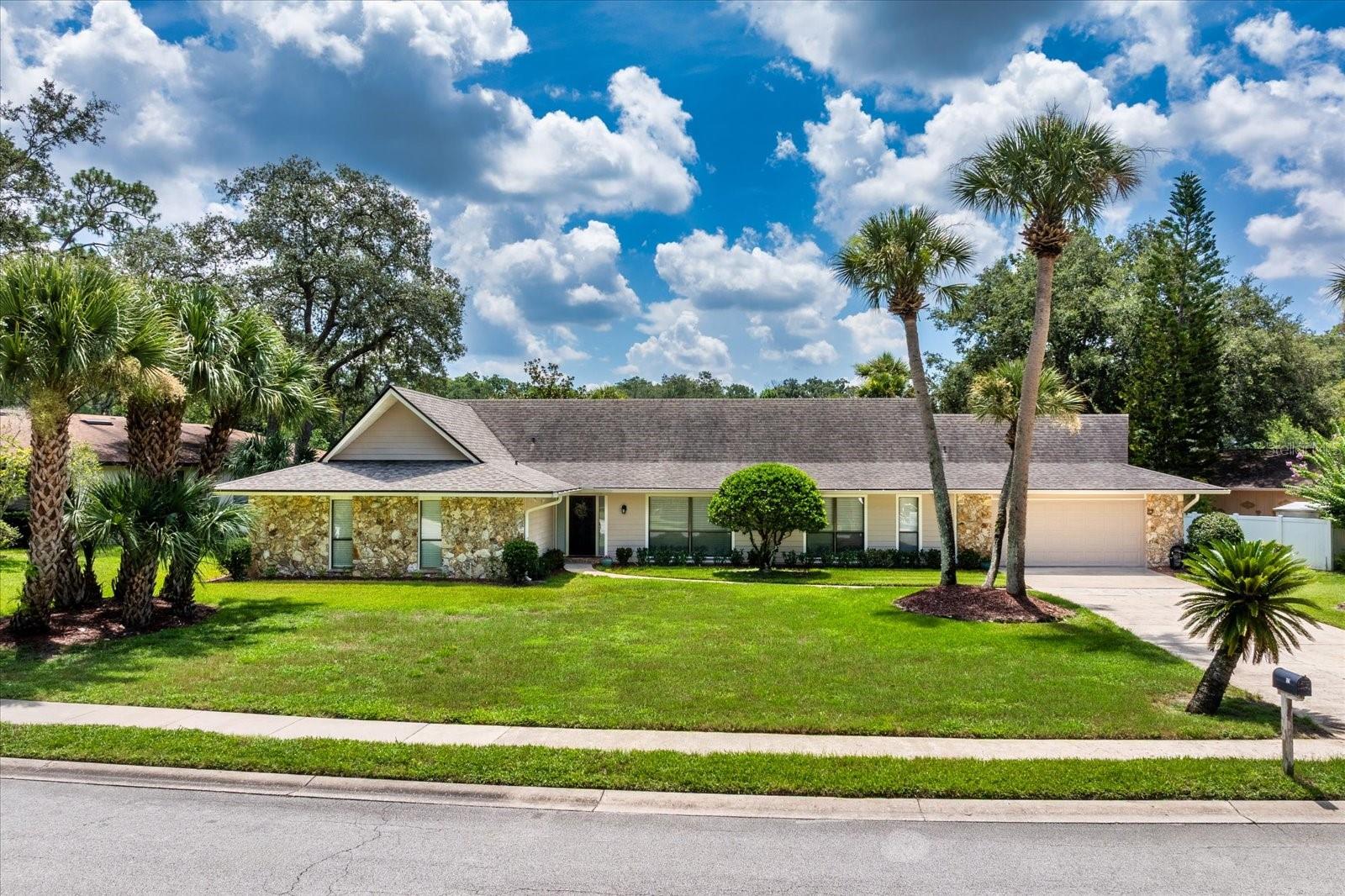 Serene pond views and updated interior. Welcome to 105 Shadow Lake Drive, where picture-perfect curb appeal and peaceful pond views create an idyllic setting in one of Longwood’s desirable communities, Sweetwater. With no neighbors in front and tranquil water views in the back, this meticulously cared-for home offers rare privacy and a lifestyle centered around beauty and relaxation. As you arrive, you’ll be drawn in by the beautifully landscaped front yard, mature trees, and charming exterior that make an immediate impression. Go inside the welcoming foyer and into a light-filled interior featuring soaring cathedral ceilings, newer wood-look tile flooring, and a thoughtful, open layout. Enjoy the flexibility of two spacious living areas, ideal for entertaining or relaxing, as well as a fully updated kitchen with sleek finishes, newer appliances, and ample counter space for cooking and hosting. The family room is a cozy yet stylish retreat, anchored by a beautiful stone fireplace mantle that adds warmth and character. The expansive outdoor living space is the heart of this home. Go out onto your oversized screened lanai with a sparkling pool, large covered lanai and wide-open pond views, ideal for entertaining guests or simply taking in Florida’s natural beauty. The generously sized backyard offers additional space for play, gardening or future customization. The primary suite is a peaceful escape, featuring private access to the backyard, a large walk-in closet and a beautifully updated en-suite bath. Additional bedrooms are well-sized and offer plenty of natural light and storage. With a 2018 roof, a transferable termite bond, updated interior finishes and unbeatable outdoor living, this home is move-in ready. Experience the blend of privacy, comfort and serene views, and schedule your private tour today!