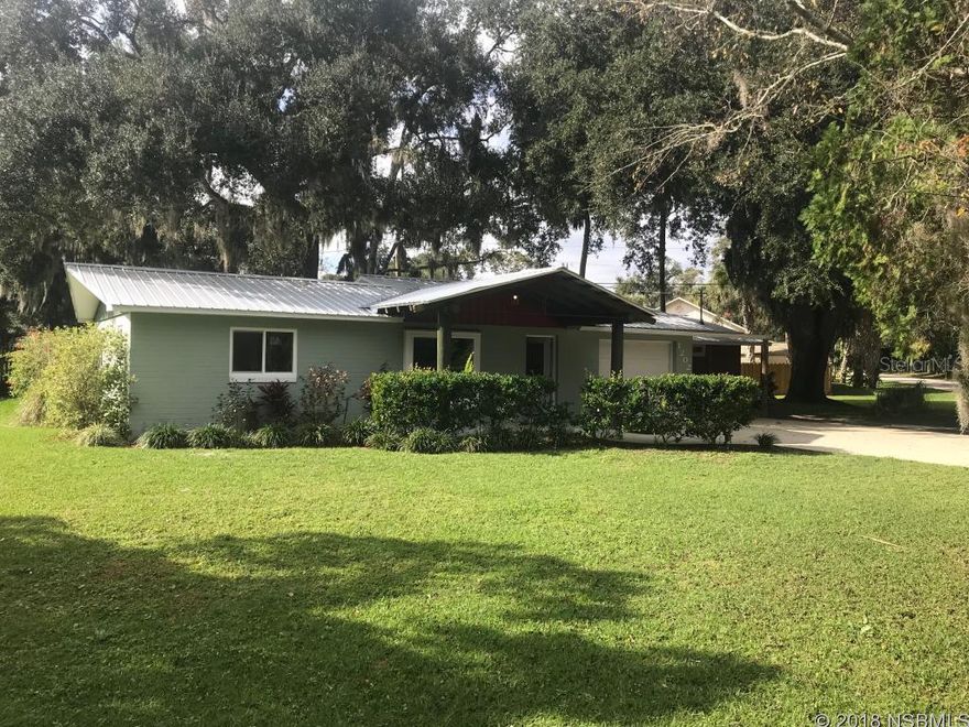 Custom home extensively remodeled by Southern Structures. This beautiful home is situated in a convenient area of Florida Shores on a large corner lot and is shaded by large oak trees. This comprehensive remodel which has made the home both eclectic and warm was completed in 2012. The philosophy behind the project was to create a home with low maintenance costs while utilizing reclaimed and re-purposed materials. The home features stained terrazzo and concrete floors, a metal roof, custom made vaulted ceilings with exposed trusses, and a wet bar. The house is trimmed throughout with reclaimed wood, the kitchen is custom made with hand-distressed cabinets and many of the light fixtures through-out the house were hand made from re-purposed materials. The home also features custom interior doors, spray-foam insulation, and a tank-less propane powered hot water heater. You can entertain with ease as the exterior of the home features a large front porch and a rear deck from which to enjoy the large backyard. This home has many custom features which are not easily replicated and must be seen to truly appreciate the level of detail and craftsmanship. ;Water: City