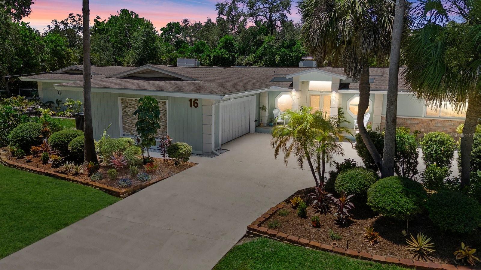 Hidden Gem Near Honeymoon Island Renovated 5BR/4Bath Pool Estate on 0.66 Acre Unique Single-Level Floor Plan, Dual Primary Suites, Duel 2-Car Garage, No Flood Zone. Welcome to one of Dunedin’s best-kept secrets, a quiet, tucked-away community of estate-sized lots just a few minutes from the Honeymoon Island Causeway, where space, privacy, and luxury converge in a rare 0.66-acre coastal property. Though the address lists Palm Harbor, this home is in the City of Dunedin and benefits from Dunedin utilities and schools. High and dry and no flood insurance required. This fully remodeled 5-bedroom, 4-bath home offers nearly 3,900 sq ft of indoor living, all on a unique and thoughtfully designed single-level floor plan that maximizes flow, light, and privacy. Completely re imagined from floor to ceiling, this home blends refined coastal style with functionality and comfort: Two full primary bedroom suites, ideal for guests, in-laws, or multi-generational living. Open living spaces with great separation between wings perfect for large family and friends to gather and entertain. All-newer flooring, interior/exterior paint, designer lighting, and modern finishes throughout. Living room/dining room combo has a wood burning working fireplace. Gourmet Kitchen with Induction Cooktop, Double Ovens, Wine Cooler, timeless travertine floors and an oversized island takes center stage. Three separate A/C systems (two new in 2023/2024) for zoned climate control allowing you to tailor comfort to different areas of the home’s unique layout, 2 newer water heaters ( approx. 2021/2022), and a 2016 shingled roof and new flat roof in 2025. With 9 sets of sliding glass doors connecting interior rooms to the outdoors, the layout encourages true indoor-outdoor Florida living. Step outside to a beautifully resurfaced PebbleTec pool, surrounded by newer pavers in a fully screened lanai. (approximately 1400 s/f of outdoor living) Covered lanai features a built-in mini fridge and is pre-wired for outdoor TV, creating a complete outdoor living and entertaining zone.Other rare features include duel 2 car garages on each side of the house and room for RV or boat parking, all with no HOA restrictions. This exceptional Home is only minutes from Pinellas Trail, Caladesi and Honeymoon Island State Park and minutes from Dunedin’s thriving Downtown. This property is as flexible as it is beautiful. This is a rare opportunity to own a true hidden gem, updated, expansive, and completely move-in ready in one of the most desirable coastal corridors in Pinellas County. Schedule your private showing today. Listing agent is owner