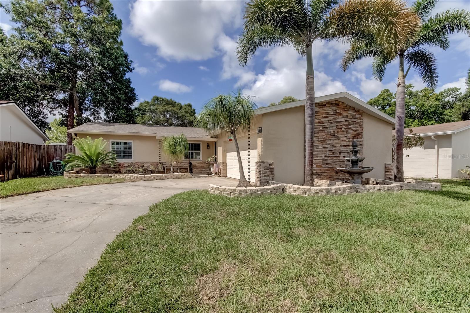 Must see 3 bedrooms 2 bath 2 car garage home in Seminole. This home has tons of upgrades. The roof was installed in June 2021 with new gutters, and the AC was installed in 2017. The front yard has fresh sod, an irrigation system, and a working fountain to add to the gorgeous curb appeal. The kitchen features a newer refrigerator and dishwasher, full-height wood cabinets, soft-close drawers and doors, granite countertops, and a full backsplash complete this beautiful and unique kitchen. There are triple-pane windows throughout with custom hurricane shutters. The hot water and attic fan are both solar-powered. There are 6-panel interior doors throughout, engineered Brazillian cherry floors in the bedrooms, and porcelain tile throughout the rest of the home. Extra insulation has been installed throughout, including the garage, which has finished floors and a hurricane-enforced garage door. The zero-scape backyard provides a maintenance-free place to relax and enjoy the screened in porch or large pavered patio. There is also a shed for extra storage.