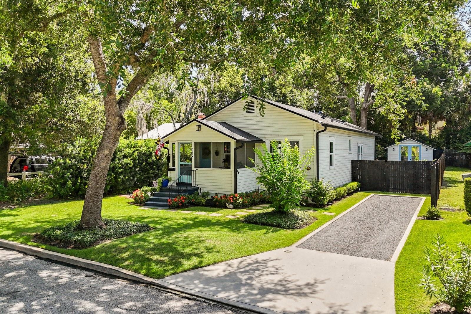 Fully renovated 1926 historic Winter Park bungalow with separate guest cottage in the heart of the Winter Park Historic District. Surrounded by a beautiful tree-lined street with brick roads, you'll be impressed by the magnificent curb appeal. Ideally located within a short distance to Park Avenue, Rollins College and the Winter Park Chain of Lakes community dock, just minutes from the Winter Park 9 golf course. Exceptional full home remodel by Z Properties in 2020 with additional updates in 2024. Completed 2024 updates include new windows, air-conditioning ducts, gutters, extended deck, landscaping, plus primary and guest baths. Completed 2020 updates include the roof, plumbing and electrical, insulation, tankless water heater, irrigation system, drainage, ribbon and gravel driveway, property fencing, French doors and more. The gourmet kitchen features a shiplap wall with hidden doors, cafe appliances, six-burner gas stove, hidden dishwasher, white stone countertops, subway tile backsplash, wooden base kitchen island with quartz countertop and a cathedral ceiling. Natural sunlight flows throughout the home and the height of the 9-foot ceilings create a cozy feel while embracing the modern elegance and historic charm. The separate cottage is under air and can be used for a personal gym, golf simulator, home office, guest suite, additional storage or more. Schedule your showing to experience the vibrant and peaceful lifestyle of Winter Park!