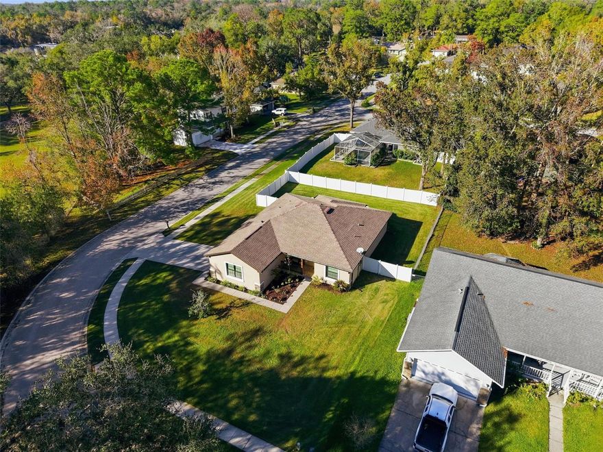 BEAUTIFUL HOME IN THE CITY OF BROOKSVILLE - our real little Hallmark Town!! Built in 2018 and situated on a large corner lot...this home offers 3 bedrooms + 2 bathrooms + 2-car garage + LARGE COVERED LANAI with BRICK PAVERS + fenced backyard + nestled on a 1/4 acre corner lot + on a dead-end paved road!! Spacious with 1,590 sq ftt; 2,392 sq ft total!! If you have been looking for a newer home in the City of Brooksville, not far from the downtown area with all the shoppes, festivals, live music...and so much more...this is it! Great lot and location!  Charming front porch to greet your company and decorate for the holidays! Large covered and screened-in rear lanai for enjoying your backyard and for entertaining family and friends!! Completely fenced backyard for your family and pets! NO HOA!! NO FLOOD!! NO CDD FEE!!  Open floor plan with high ceilings! Dining room and breakfast nook! Large great room!! Split floor plan offers privacy for the master suite!!  Sprinkler System. Gutters and downspouts! Just a beautiful home in a beautiful location! 45 minutes to Tampa International Airport! Just over an hour to TOP US Beaches! 25 minutes ot sunsets at Pine Island! 20 minutes to kayaking the crystal clear Weeki Wachee River and swimming with the manatees!! Fishing, boating, hanging out on the boat at the Flats! The area has so much to offer!! Come see it today!!