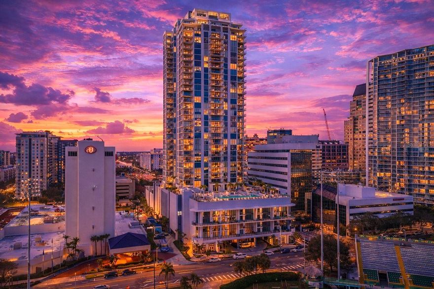 Perched on the 15th floor of Saltaire, one of Downtown St. Petersburg’s newest and most exciting luxury high-rise towers, Residence 1505 delivers an elevated lifestyle defined by design, light, and unforgettable sunsets. This west-facing residence captures sweeping views across the city toward the Gulf Coast Beaches, where golden skies melt into evening from your expansive covered balcony—a front-row seat to St. Pete’s most breathtaking sunsets. Inside, the spacious open floor plan of impeccably curated living space unfolds with effortless sophistication. Floor-to-ceiling windows flood the home with natural light, accentuating the soaring 10-foot ceilings and creating a seamless connection between indoors and out. Underfoot, 24” x 48” tile flooring lends a modern elegance that flows throughout the residence. The thoughtfully designed layout features two (2) spacious bedrooms, each with its own en-suite bath, plus a versatile den ideal for a home office, media lounge, or guest retreat, along with an additional half bath for entertaining. For added convenience, just off the den you'll enjoy a large walk-in laundry room with an added storage closet. Generous walk-in closets and custom storage ensure both form and function are beautifully balanced. At the heart of the home, the chef-inspired kitchen is a statement of modern luxury—showcasing quartzite countertops, sleek European cabinetry, and top-of-the-line panel ready JennAir appliances. Whether hosting intimate dinners or lively gatherings, the kitchen opens effortlessly into the living and dining areas, framed by skyline views and glowing sunsets beyond. The primary suite serves as a serene sanctuary, complete with spa-inspired baths and refined finishes that invite relaxation at the end of each day. Every detail has been considered to create a residence that feels both polished and welcoming. Life at Saltaire extends far beyond your front door. Residents enjoy a full-service, resort-style experience with 24/7 security and concierge, valet parking, and an exceptional collection of amenities. Highlights include a state-of-the-art fitness center, a dog park with pet wash, elegant club and business spaces, bike storage, and a stunning infinity lap pool with panoramic views of Downtown St. Pete, Rowdies Stadium, and the shimmering waters of Tampa Bay. Private cabanas elevate poolside living to true resort standards. This residence includes one deeded parking space with upgraded EV charger and a private storage unit, adding convenience to luxury. Just moments from waterfront parks, world-class dining, boutique shopping, vibrant nightlife, and St. Petersburg’s celebrated arts and cultural scene, Residence 1505 places you at the center of it all. This is more than a condo—it’s a lifestyle above the city, where modern luxury, iconic sunsets, and Downtown St. Petersburg converge.