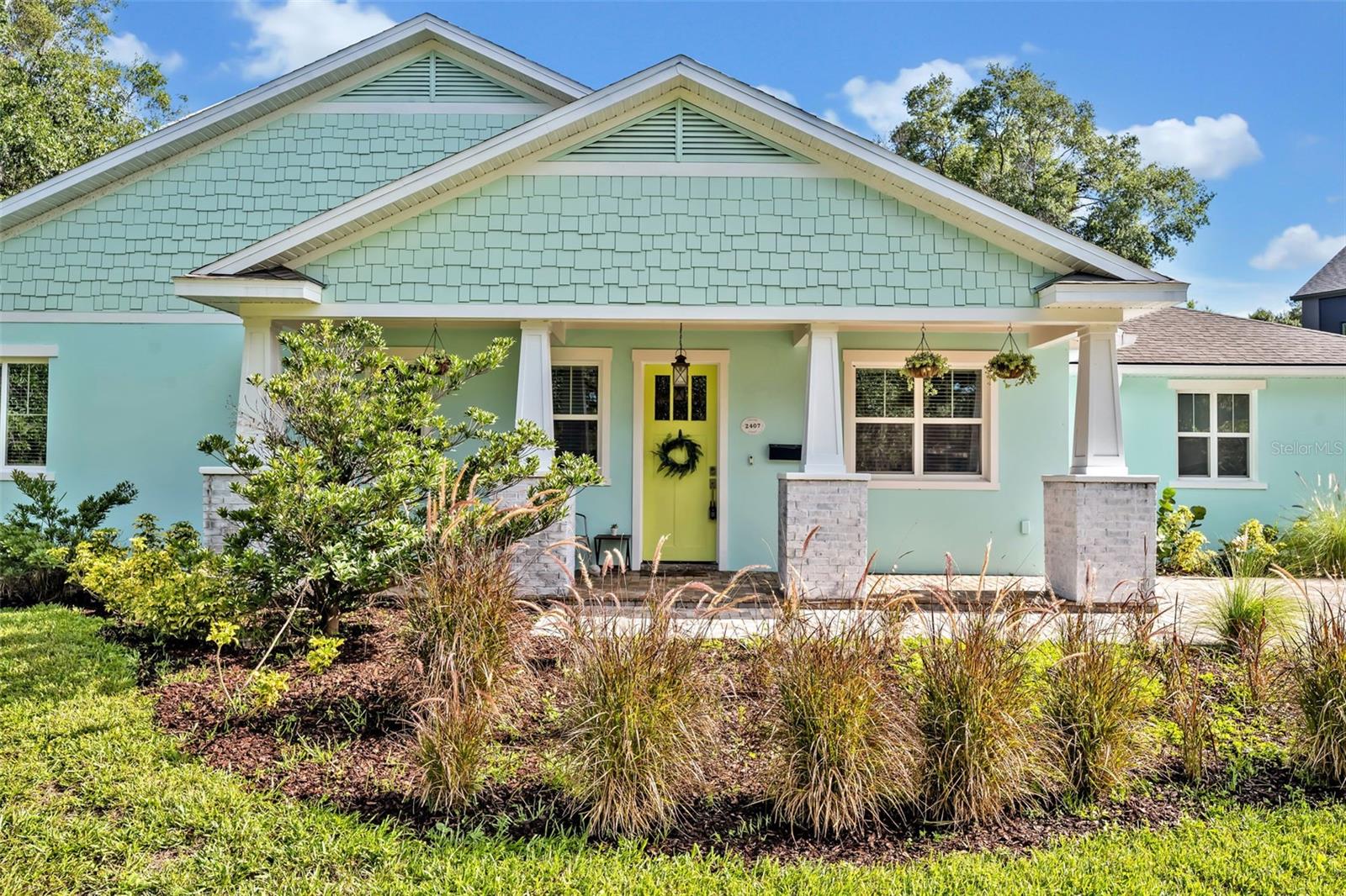Welcome to this beautifully crafted home located in one of Orlando’s most desirable neighborhoods; the vibrant Audubon Park Garden District. Step inside to a spacious and airy living room featuring vaulted ceilings with exposed beams, creating a warm and inviting atmosphere. The open concept layout seamlessly connects to a chef inspired kitchen, complete with stainless steel appliances, a farmhouse sink, abundant cabinetry, and expansive counter space perfect for entertaining or everyday living. A large island provides extra seating and a natural gathering space for guests. Above the dining area, a beautiful tongue-and-groove wood ceiling adds a custom touch that ties in perfectly with the ceiling beams. French doors lead out to a covered back patio, also finished with tongue and groove detailing. The back patio has newly installed screens which make relaxing in the hot tub comfortable and easy. And the large fenced in yard is ideal for outdoor activities or future plans for a pool. The primary bedroom is tucked away at the rear of the home and features a generous walk-in closet and a spa-like ensuite bath. Energy Star rated windows throughout the home will make sure that the home is always comfortable and efficient. Additional highlights include a rare three car garage, and an unbeatable location just minutes from Downtown Orlando, Baldwin Park, Ivanhoe Village, Mills 50, The Milk District, Winter Park, Leu Gardens, Lake Druid Park, and the Cady Way Trail. Audubon Park is known for its A+ school at the Audubon K-8, it's unique neighborhood charm and creative spirit is filled with vintage shops, cafes, local bakeries, breweries, bookstores, and year-round events. It’s also recognized as a Community Wildlife Habitat by the National Wildlife Federation; the first in Central Florida to earn this distinction. Living here is more than a home; it’s a lifestyle. Don’t miss your chance to own a piece of Audubon Park!