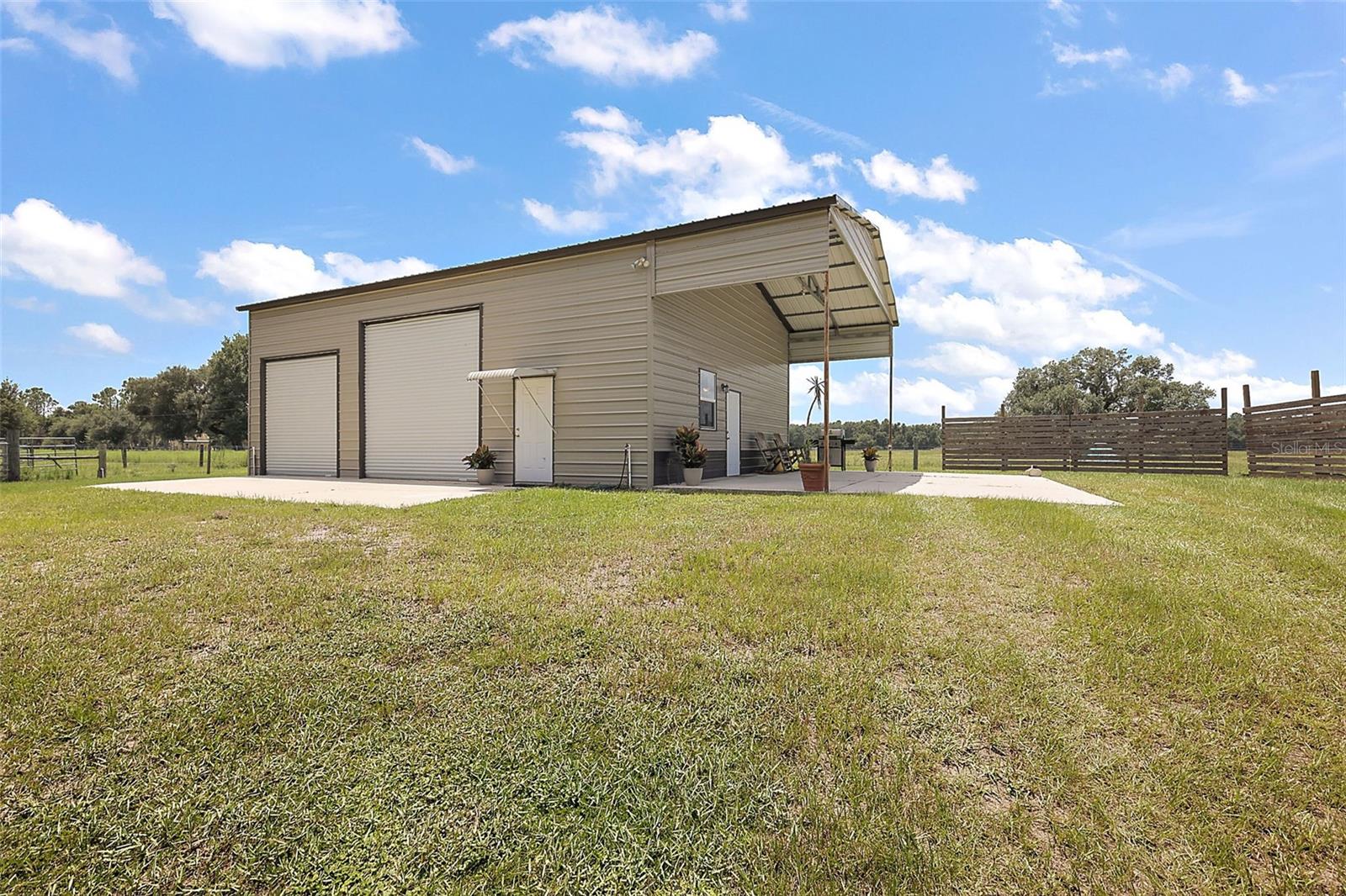 Welcome to the country! Bring your livestock, tractor, outdoor toys, and love of a country-living lifestyle! This beautiful 10-acre rural property in Sumter County, Florida, is fully prepared for your dream home. The land is cleared and build-ready, with essential utilities including underground electricity (plus electrical panel), running water (private well), and septic-ready infrastructure already in place. There is an RV pad connected to the barn that is both electric and septic hook-up ready. This charming property is blessed with abundant southern live oak trees, wild blackberries, and sprawling pastures.
A large well-maintained enclosed barn (30x40 ft w/ 10x30ft porch pad) features a comfortable efficiency apartment complete with all amenities, making it ideal for temporary living, guests, or rental income. The barn features a huge open space for a workshop/storage and two spacious, open storage lofts. The property is already fenced and cross-fenced, providing secure and functional areas for livestock or agricultural use. The property also has an open shed (36x20ft) for tractors and other equipment storage. Located in a peaceful setting with easy access to nearby amenities, this versatile parcel offers the perfect blend of country living and modern convenience. Whether you're looking to establish a homestead, hobby farm, or simply enjoy the space and privacy, this property is a rare opportunity with immediate potential. Book a showing appointment today! (Shown by appointment only - Property Occupied)