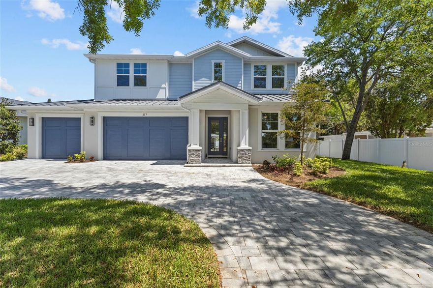 Introducing THE RETREAT, a stunning two-story residence.  FOUR (4) bedroom, THREE (3) bath.   Paver driveway, 3 CAR GARAGE, LVP flooring.  Home has been professionally staged.  Pool is complete; size 12 x 26 , leaving plenty of green space for pets in the backyard!   This exceptional new build boasts superior block construction, a durable metal roof, impact-resistant windows, doors, and sliders.  Inside is a thoughtfully designed open floor plan, featuring soaring 10-foot ceilings and elegant 8-foot solid core doors that enhance the home’s impressiveness.  The gourmet kitchen is complete with a 6-foot island, luxurious quartz countertops, custom shaker cabinetry, and a top-of-the-line appliance package, perfect for both daily meals and entertaining.  
The primary bedroom, located on the main level, is a serene retreat with stunning tray ceilings, large his/her walk-in closets, double vanity, and a spacious walk-in shower.  Bedroom #2, also on the first floor, is versatile and can serve as an additional bedroom or a home office. Upstairs, you'll find two more generously sized bedrooms that share a beautifully appointed full bathroom.
The home’s detailed interior is complemented by luxury vinyl plank flooring throughout both levels, providing durability and style. Outdoors, a gas-heated saltwater pool and paver deck creates the ideal setting for relaxation and entertainment.    Conveniently located with easy access to downtown Sarasota, the Legacy Trail, Payne Park, Sarasota Memorial Hospital, and the world-renowned beaches of Longboat and Siesta Keys, this home offers the perfect blend of luxury, comfort, and convenience for modern family living.    Experience elevated living at its finest in "your RETREAT"!