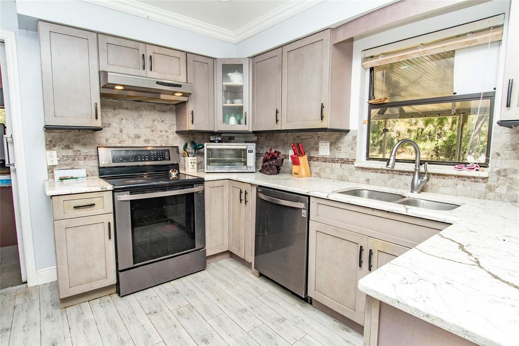 Photo of 4022 Canaveral Groves Boulevard, Cocoa, FL 32926 (MLS # O6394923)