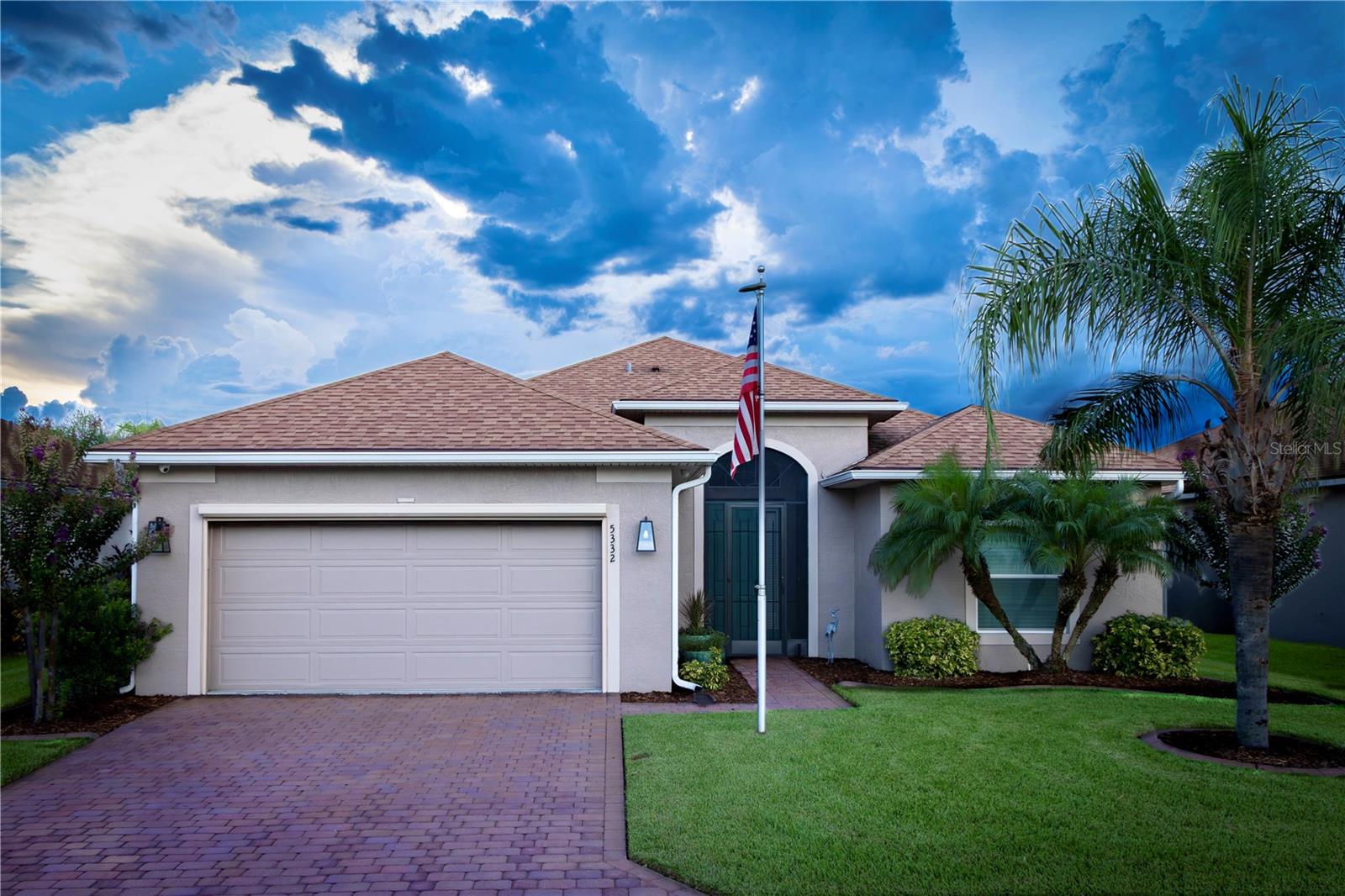 Welcome to your personal haven and next chapter in beautiful Lake Ashton—Central Florida’s premier 55+ active-adult community. This immaculate oasis with its extraordinary salt-water pool offers a perfect blend of tasteful style, elegance, and Florida charm. And the CDD debt is paid in full, saving you near $10,000! With 2 spacious bedrooms, 2 full baths and a den, this open-concept floor plan, with 10’ ceilings and 8’ doors feels spacious, yet warm and comfortable. It is ideal for both relaxed living and gracious entertaining. From the moment you arrive, you’ll be captivated by lush landscaping, a stately Queen Ann palm, and a welcoming screened entry. Lovely 18” Wheat colored ceramic tile flooring set at an angle adorns the entire house. The kitchen features Seacrest 42” cabinets in glazed maple with bump-ups, bump-outs and crown molding, and deluxe stainless appliances. An R/O water purification system is at the kitchen sink, and the home has a water softener. Giallo Ornamental Classic granite with 1/2 Bullnose serves as counters in the kitchen and both baths. Multiple banks for drawers are in the kitchen and primary bath cabinets. Installed in 2022, the inviting 26’ x 8’ heated, salt-water pool with waterfall features Pebble Tech Natural Pebble pool finish. The waterfall, pool lights, temperature and circulating pump are Pentair Technology Pool controlled by an app on your phone! Three motorized SPF privacy screens enhance seclusion and there are two motorized awnings providing abundant shade. The veranda and pool decking are travertine tiles for stunning, classic beauty and functionality. The south end of the veranda is walled in. The LG 42” television on the veranda conveys with purchase. The spacious, screened enclosure in bronze color features 20/20 screen (to keep small insects out), and oversized support beams. The home hosts an owned solar system that allows an average $60 per month electricity bill as it supports total electricity utilization, including the pool heater. This home is as practical as it is luxurious. More than a house with a pool, this property is an outstanding retreat for entertaining and personal relaxation, and it is located it beautiful Lake Ashton. More than a neighborhood, Lake Ashton is a lifestyle. Residents enjoy two 18-hole championship golf courses, a 26,000 sq ft clubhouse, a state-of-the-art Health & Fitness Center, both indoor and outdoor swimming pools, pickleball courts, bowling alley, theater, on-site restaurant, and a vibrant calendar of social events and clubs. Don’t miss this exceptional opportunity to own a home that truly has it all. Call today to schedule your private showing—your Florida dream awaits!