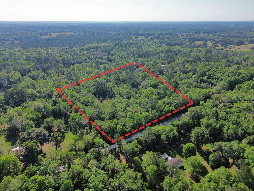 This 4.50 acre lot in Flemington Ranches offers a peaceful rural setting with convenient access to natural attractions and essentials. Zoned A1 General Agriculture, this parcel measures approximately 400 feet of frontage by 490 feet of depth. NO FLOOD ZONE. Road access is provided by a smooth county-maintained dirt road. Electricity is available through Clay Electric. Approximately 7 miles northeast of downtown Williston, close proximity to everyday conveniences such as a Winn-Dixie grocery store, Dollar General, and Circle K. Significant natural attractions are also nearby, including The World Equestrian Center, Devil's Den Prehistoric Springs, and Rainbow Springs State Park. Larger urban amenities are accessible in Gainesville and Ocala, both approximately 25-35 miles away.

Parcel ID: 01451-003-02
Coordinates: 29.409244, -82.361588
