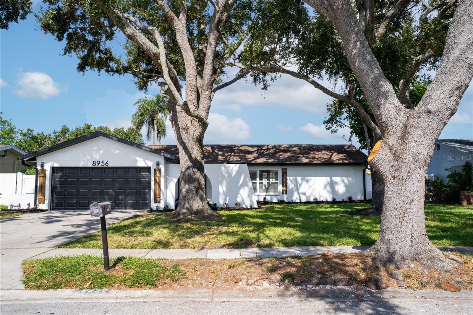 Welcome to this beautifully updated 3 bedroom, 2 bathroom, 2 car garage pool home located in the heart of Seminole, Florida! This move-in ready gem features a brand new HVAC system, fresh interior and exterior paint, new lighting and fixtures, and stylish new LVP flooring throughout. The open-concept layout seamlessly connects the living room, dining area, and stunning new kitchen—complete with stone countertops, stainless steel appliances, and a breakfast peninsula. There is also a separate family room for additional entertainment space. The split bedroom floor plan offers privacy, with an oversized primary suite featuring a walk-in closet and a spa-like en-suite bath with a walk-in shower. The updated guest bathroom includes dual sinks, perfect for family or guests. Step outside to the expansive screened-in pavered lanai and in-ground pool—ideal for relaxing or entertaining year-round. Located in a non-flood zone near Walsingham Park, the Florida Botanical Gardens, downtown St. Pete, Gulf beaches, and countless dining, shopping, and entertainment options. Don’t miss your chance to own this Seminole stunner—schedule your private showing today!