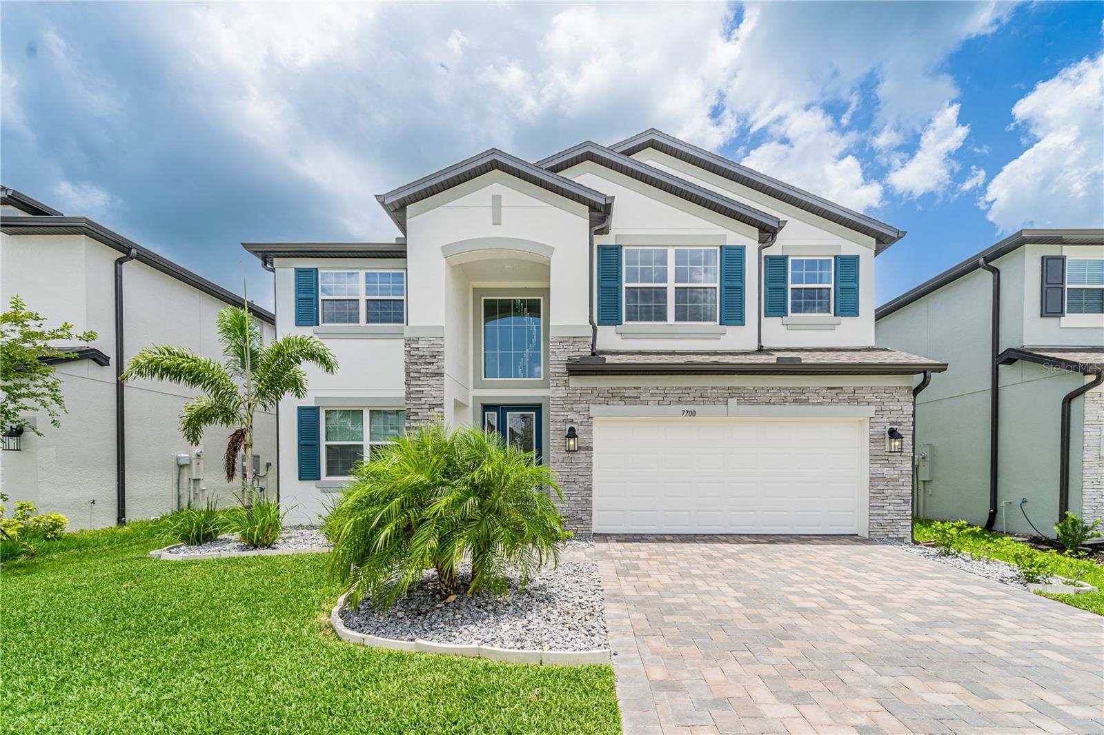 No CDD and Low HOA. Welcome to Whispering Oaks Preserve! This executive-style home shows like new construction and is absolutely pristine. It features 5 spacious bedrooms, 3 full baths, and a 3-car tandem garage perfect for oversized vehicles or boat storage. Enjoy upgrades throughout, including professional tropical landscaping, upgraded stainless steel appliances with double ovens, quartz countertops in the kitchen and bathrooms, a butler’s pantry with extra cabinetry, and a huge walk-in pantry. Beautiful Marble-look tile flooring runs through all main living areas, Wood Stairs and Luxury vinyl Plank on the second floor bathrooms, and the laundry room. The owner’s suite offers a spa-like bathroom with dual sinks, a soaking tub, a large walk-in shower, a private water closet, and a spacious walk-in closet. Additional highlights include upgraded lighting, soft-close cabinetry, a large indoor storage closet, epoxy flooring in the garage, and gutters around the home. The extended, covered, and screened lanai is perfect for relaxing or entertaining. This gated community is located in the heart of Wesley Chapel, close to top-rated schools, Advent Health and BayCare hospitals, Saint Leo University, Pasco-Hernando College, Wiregrass Mall, Tampa Premium Outlets, Krate at The Grove, and new Publix and Chick-fil-A just minutes away, with easy access to I-75, I-275, Downtown Tampa, and Florida’s beaches. Schedule your private showing today and make this stunning home yours! FRIGED WASHER & DRYER is non convey on the Sale.