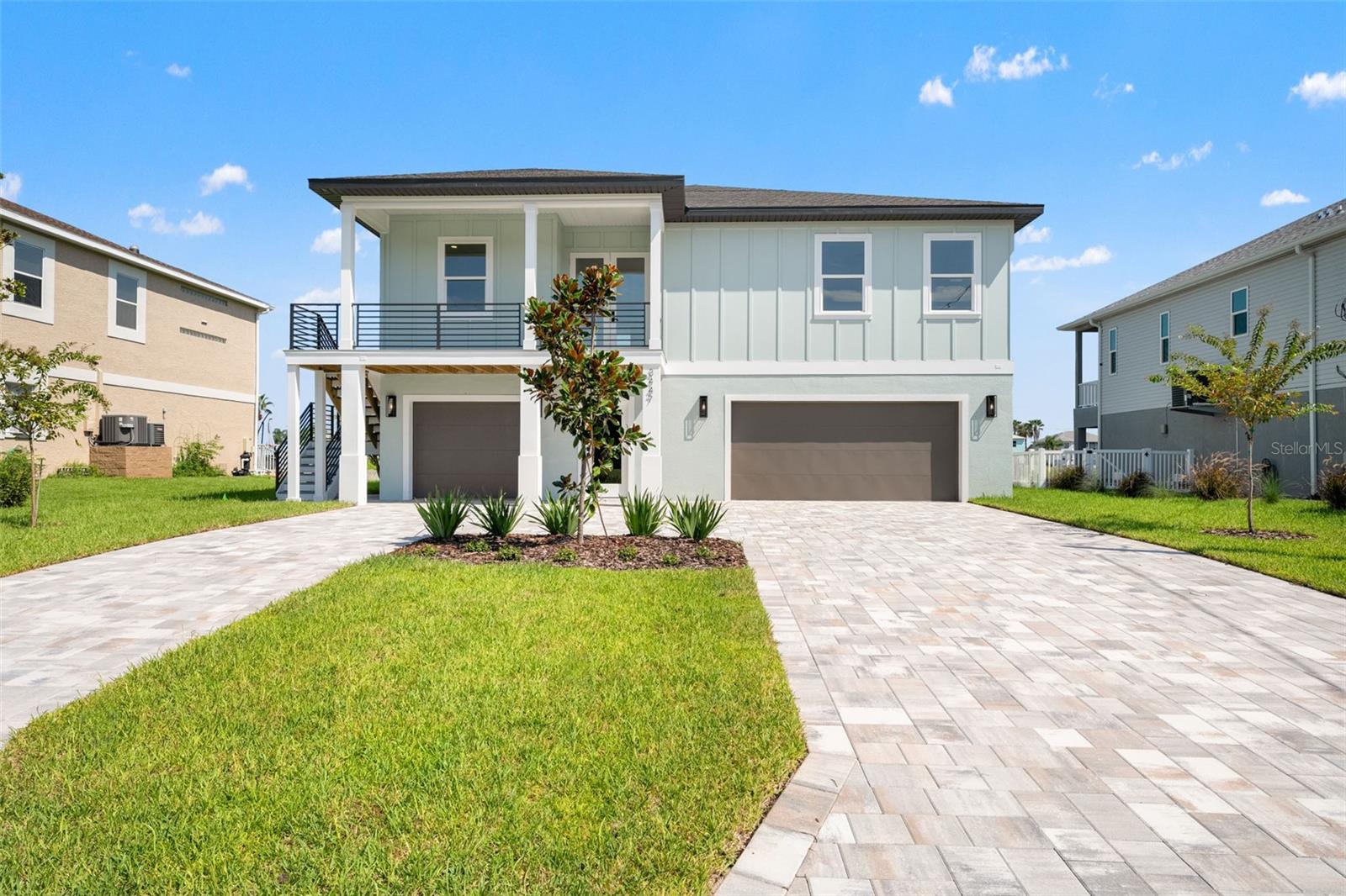 Experience the perfect blend of strength, sophistication, and waterfront living in this brand-new Hernando Beach residence. Built with hurricane-ready engineering, including deep pilings and engineered breakaway walls, this home ensures long-term security while embracing modern coastal design. Inside, dramatic grand 12 foot tray ceilings set the tone for open, airy living. Expansive windows flood the home with natural light and frame sweeping waterfront views. The culinary-grade kitchen is both functional and refined, featuring custom full-height soft-close cabinetry, quartz slab countertops, a statement island with designer pendant lighting, and integrated finishes that elevate every detail. Crafted for resilience, comfort, and efficiency, the home includes impact-rated Pella windows and doors, a GAF Lifetime shingle roof with secondary water barrier, Zip-Sheathing waterproofing, concrete block first level with engineered blow-out walls, and Wi-Fi enabled impact-rated garage doors. A Comfortmaker three-ton 15 SEER HVAC system with programmable thermostat provides climate efficiency, while prewiring for Ethernet, smart shades, security, and surveillance ensures modern convenience. A dedicated elevator shaft is in place, allowing for effortless installation of a private elevator when desired. The oversized garage offers capacity for up to six vehicles, providing unmatched storage for cars, boats, or recreational equipment. Outdoors, the property is finished with a seawall, paver driveway, professional landscaping with St. Augustine sod, and a four-zone irrigation system. Step outside to enjoy direct canal access to the Gulf of Mexico, ideal for boating, fishing, and the Florida lifestyle. Hernando Beach is recognized as the most affordable way to live on waterfront with Gulf access in the Tampa Bay area, offering buyers the rare opportunity to enjoy a luxury coastal lifestyle at a fraction of the cost of other waterfront communities. Just minutes away, the Hernando Beach Marina provides high and dry storage, wet slips, a full-service boat yard, sales, and maintenance. The neighborhood also offers access to the Hernando Beach Club, a private waterfront social club for gatherings, dining, and entertainment on the water. Located in Hernando Beach South, the home also benefits from HOA oversight that helps maintain neighborhood standards and long-term property values. With a one-year builder warranty and transferable manufacturer warranties included, this residence is as secure as it is stylish. This is more than a home. It is a statement of lifestyle. Beyond your doorstep, Hernando Beach offers countless ways to relax and explore. Spend weekends scalloping, fishing, or island hopping in the Gulf. Pine Island Beach is minutes away for sandy shores and picture-perfect sunsets, while Weeki Wachee Springs invites you to kayak crystal-clear waters and spot manatees up close. Locals enjoy fresh seafood restaurants, tiki bars with live music, and waterfront dining where you can arrive by boat. Adventure seekers can bike through the Weeki Wachee Preserve, launch paddleboards from hidden canals, or join the lively boating scene that defines the area. From neighborhood festivals to coastal sunsets, Hernando Beach is where everyday living feels like a getaway. Secure your place in one of Florida’s most unique waterfront communities today.