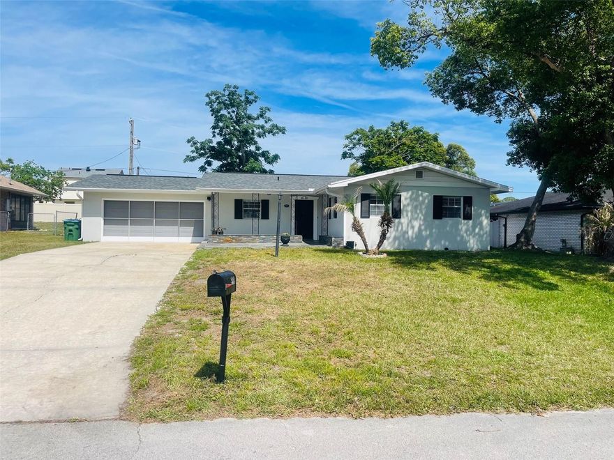 Charming home near all major highways. BRAND NEW ROOF just installed. NEW AIR CONDITIONER INSTALL 2025. Huge fenced in yard perfect for entertainment. Sliding screened garage, a plus. Pride in home ownership. Pack your bags you are moving to Florida!