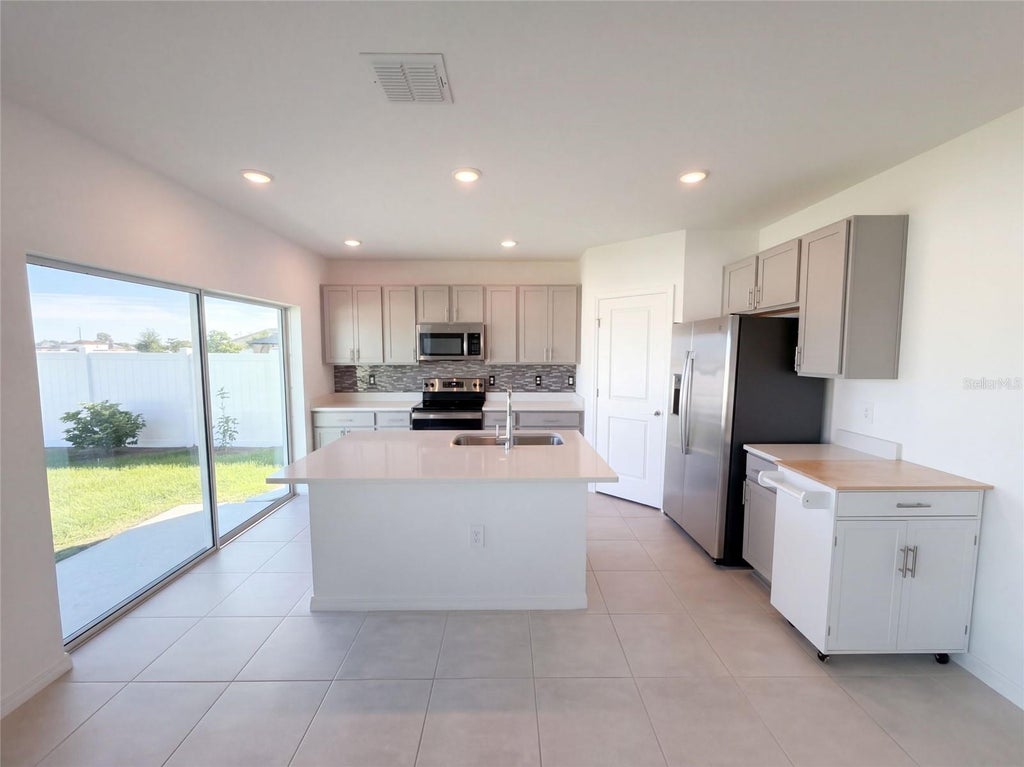 Photo of 124 Citrine Loop, Kissimmee, FL 34758 (MLS # O6448366)