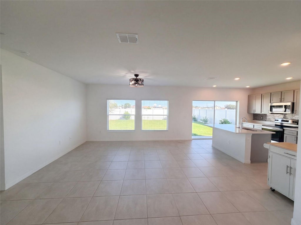 Photo of 124 Citrine Loop, Kissimmee, FL 34758 (MLS # O6448366)
