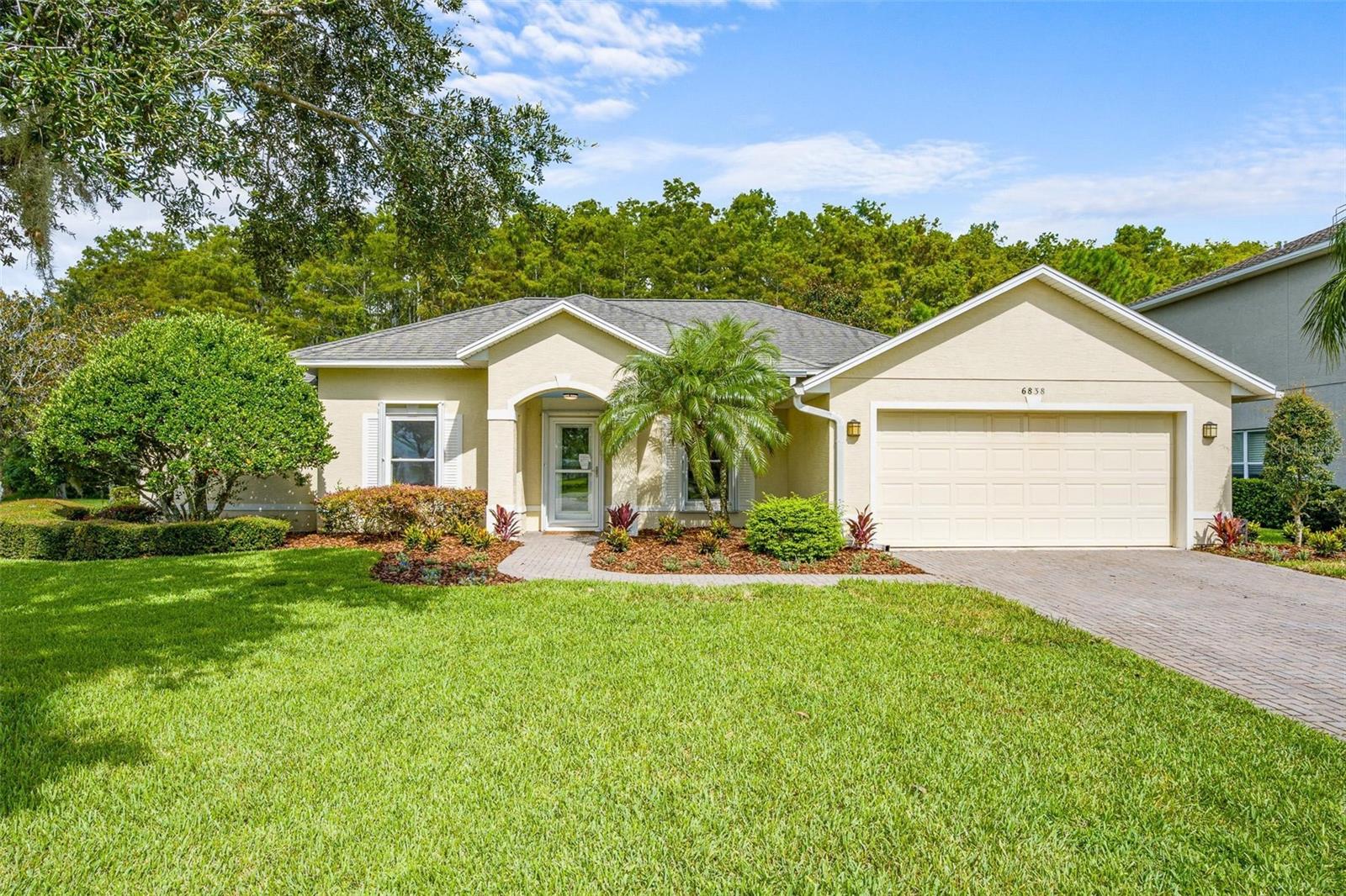 Welcome to this beautifully maintained 4-bedroom, 2-bathroom former model home in the highly sought-after Waters Edge community of Port Orange, FL. Set on a premium corner lot, this residence showcases manicured landscaping, a fenced yard, and borders a Nature preserve for a perfect blend of privacy and curb appeal.
Inside, the open floor plan features raised ceilings, a formal dining room, and a chef’s kitchen complete with solid wood cabinetry, Silestone countertops, stainless-steel appliances, and both table and bar seating. From the open living area, sliding glass doors extend your living space outdoors to a screened-in porch, with an additional 400 sq ft paver patio, and custom pergola.
This split bedroom floor plan ensures privacy and comfort for family or guests.The expansive master suite is a private retreat, featuring a custom Closet By Design system and a large ensuite bathroom.
This home has been thoughtfully upgraded, including: double-pane windows (2018), HVAC system (2020), pergola (2021), and fresh interior paint (2025). Additional practical features include a full irrigation system, gutters, front storm door, and hurricane shutters on all windows, doors, and sliders.
Water's Edge is one of Port Orange’s premier communities, known for its top-rated schools, tranquil surroundings, and family-friendly atmosphere. Located less then 15 minutes from the Beach and surrounded by top ranked Golf Courses. Schedule your private tour today!