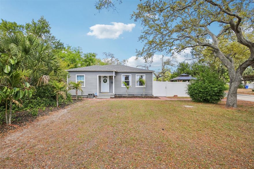 Step into the St. Pete lifestyle with this inviting 2-bedroom, 2-bath home set on a huge, fully fenced yard in one of the area’s established, tree-lined neighborhoods. Just minutes from the beaches, vibrant downtown, local cafés, parks, and waterfront sunsets, this home offers the perfect blend of convenience and calm.

Inside, thoughtful updates create a bright, comfortable atmosphere that feels instantly welcoming. The open living spaces flow easily, the bedrooms offer great versatility, and both full baths are designed for everyday ease.

The oversized yard becomes your personal oasis—ideal for gardening, entertaining, pets, play, or simply soaking up the Florida sunshine. With full fencing already in place, it’s ready for whatever lifestyle you imagine.

A 1-car garage with alleyway access adds rare functionality, offering secure parking, storage, or workshop potential while keeping the front of the home clean and charming.

Updated, move-in ready, and prepared for its new owners, this home delivers the best of St. Petersburg living—location, character, and outdoor space that’s hard to find.